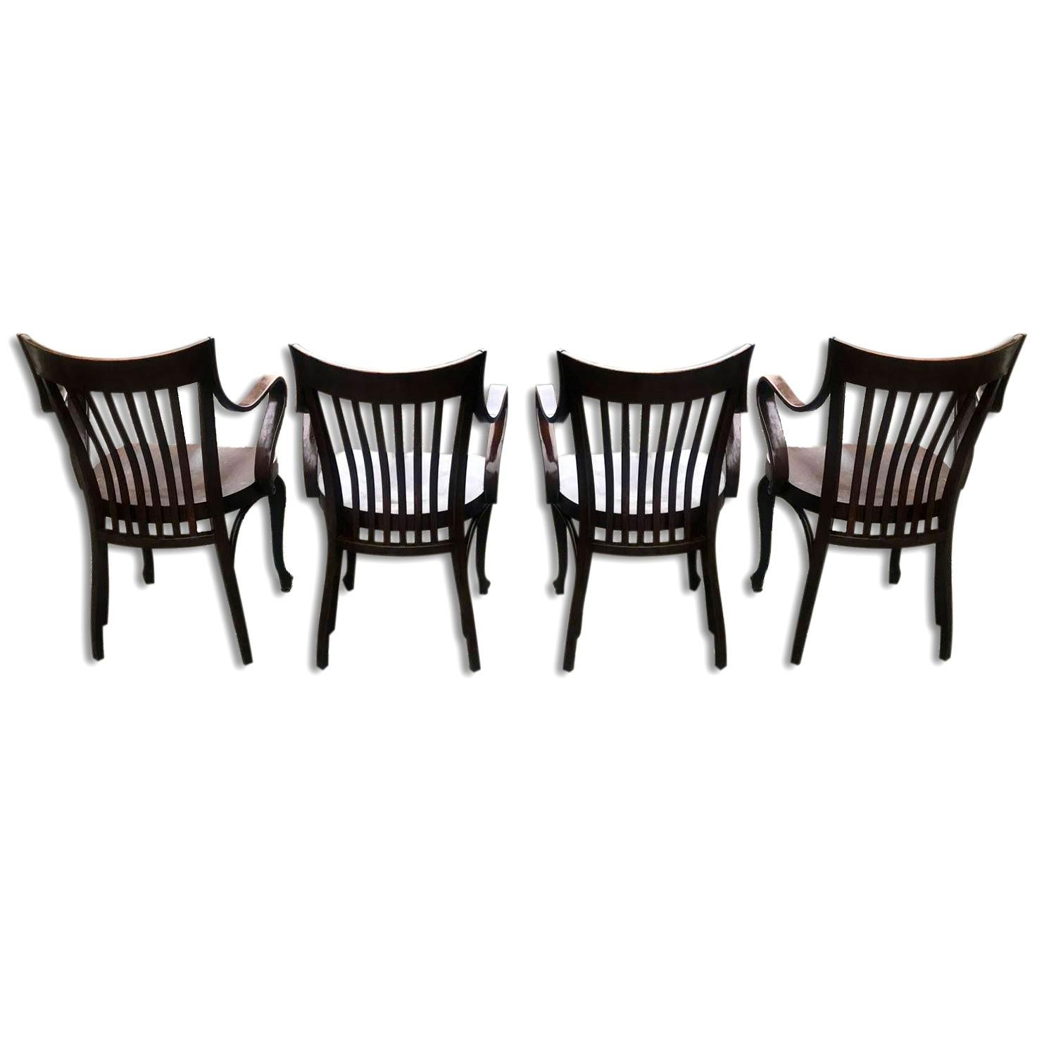 These chairs were designed in 1913 for the Café Capua in Vienna, manufactured by Thonet. It features a beech stained wood, impressed factory mark to the underside. The chairs are in very good original condition.

Literature.: E. B. Ottillinger,