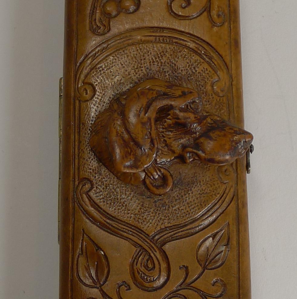 A most unusual piece of Black Forest, a travel desk thermometer in a wooden case with carved decoration and a beautifully carved Dog's head to the front, great detail and beautifully executed.

Dating to circa 1890-1900 it remains in excellent