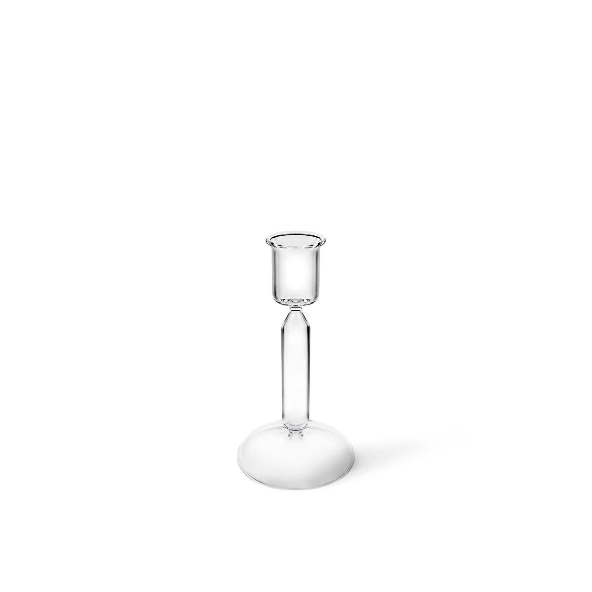 Luna is a handmade transparent candle stick in mouth blown glass designed by Aldo Cibic, it is available in three different sizes. This piece is a timeless object whose curvy Silhouette corresponds to the archetype of the candlestick. Luna – like