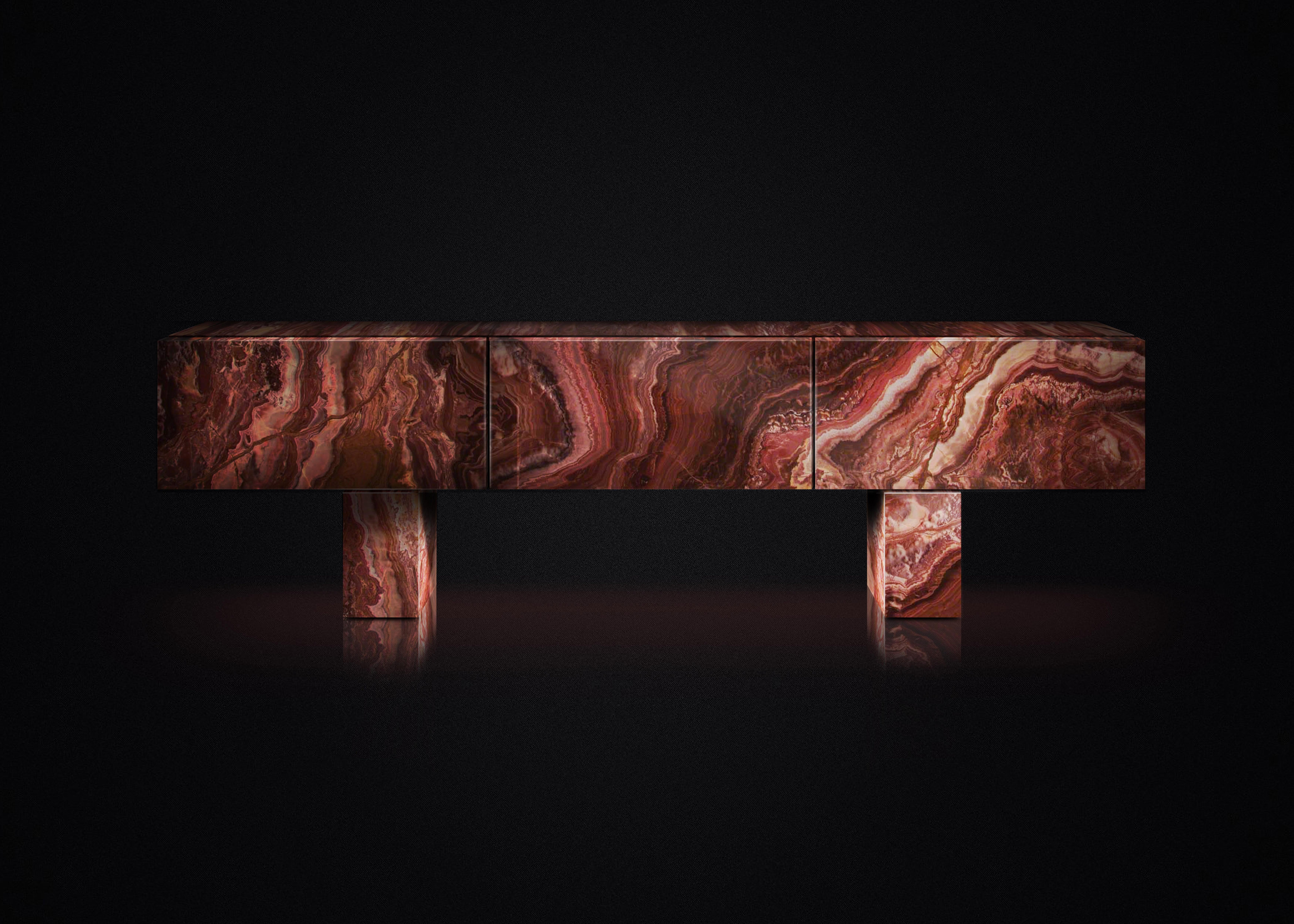 Console Diablo.

Directly inspired by natural beauty of Iceland. Made of Red Passion Onyx stone. Interior Macassar Ebony,
Contemporary, luxurious and impeccably crafted, this credenza makes a beautiful home investment. The design works a