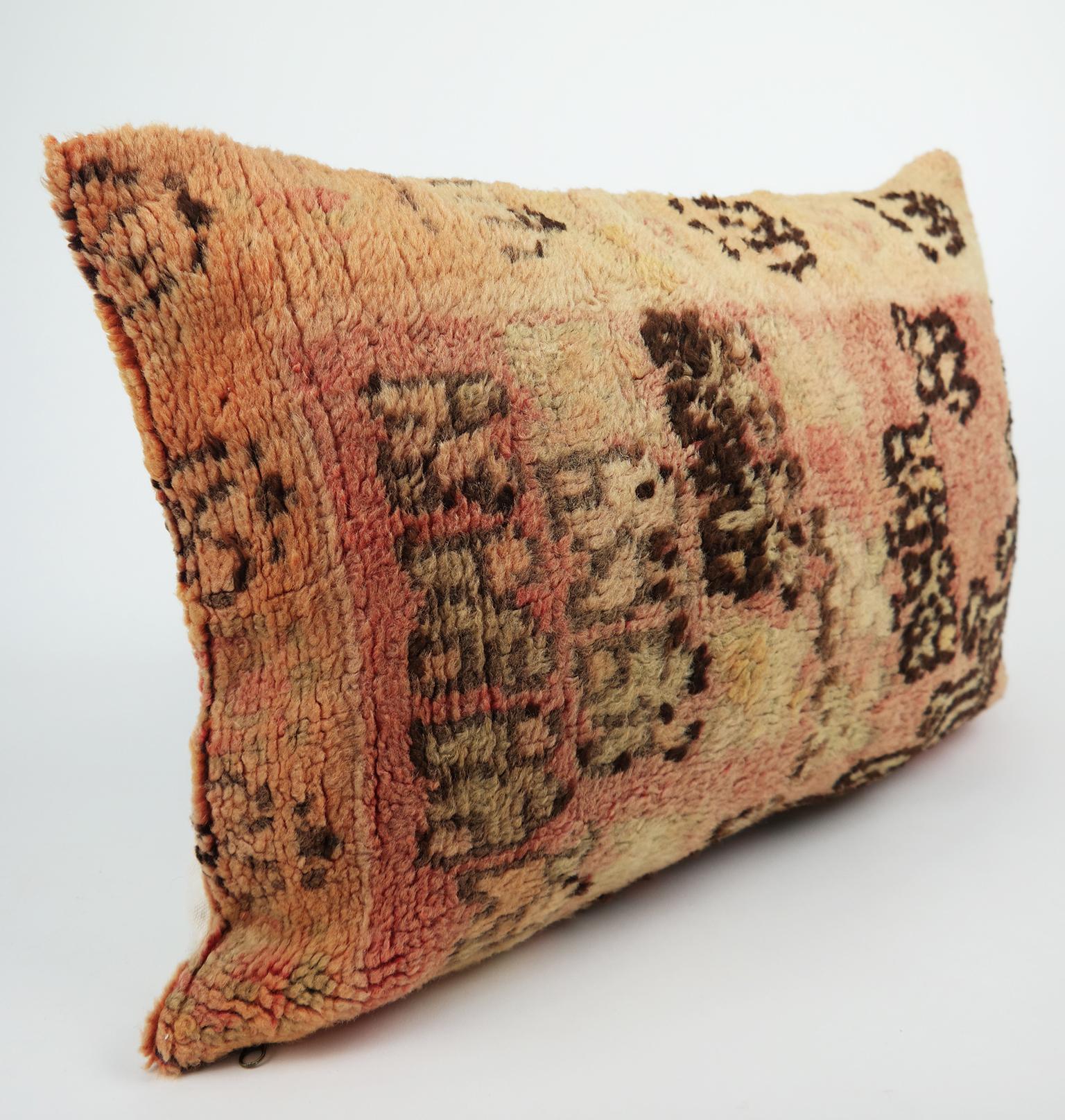 Cushion custom-made from a more than 40 years old Moroccan rug. The rug is searched and selected by ourselves. This pillow is a one-of-a-kind with beautiful warm colors. shades of warm orange, faded pink, chocolate brown, sand and vintage