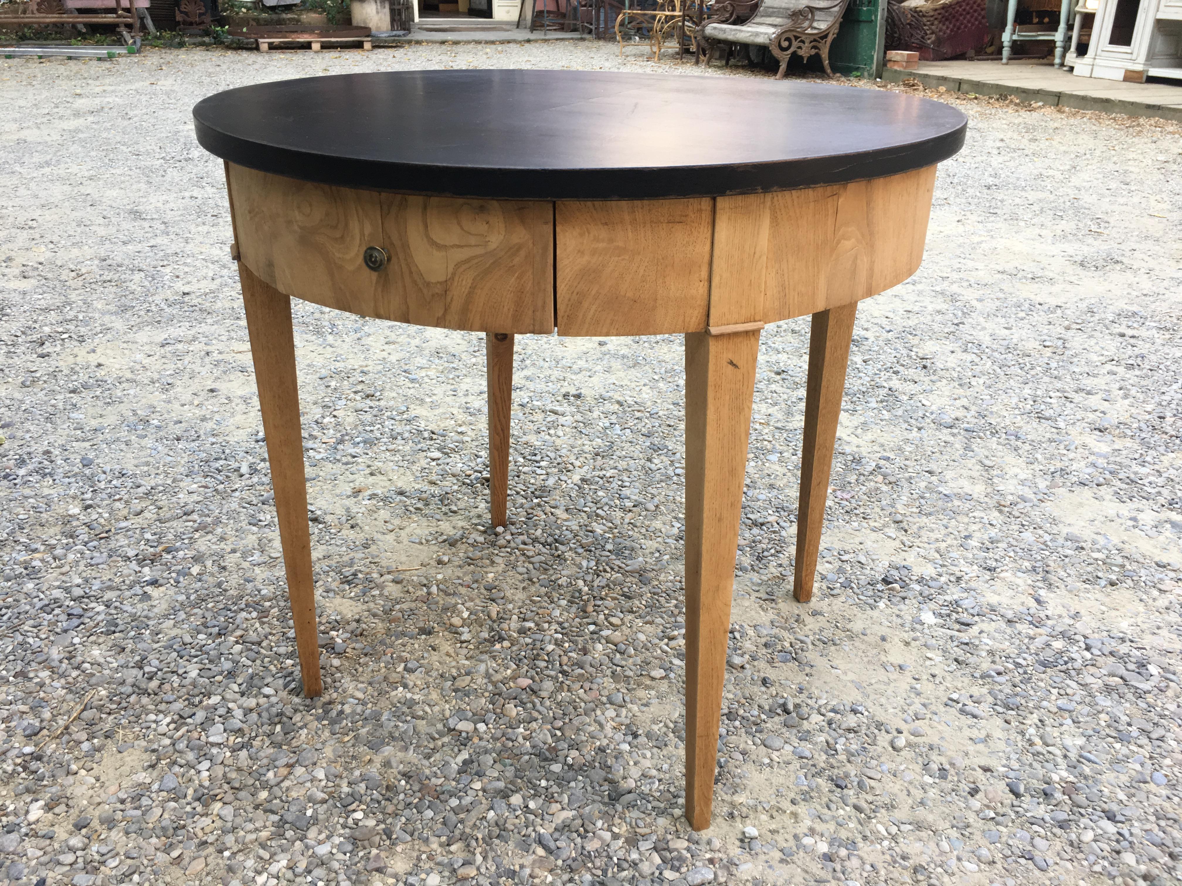 Mid-Century Modern oak table with black lacquered top from 1950s.