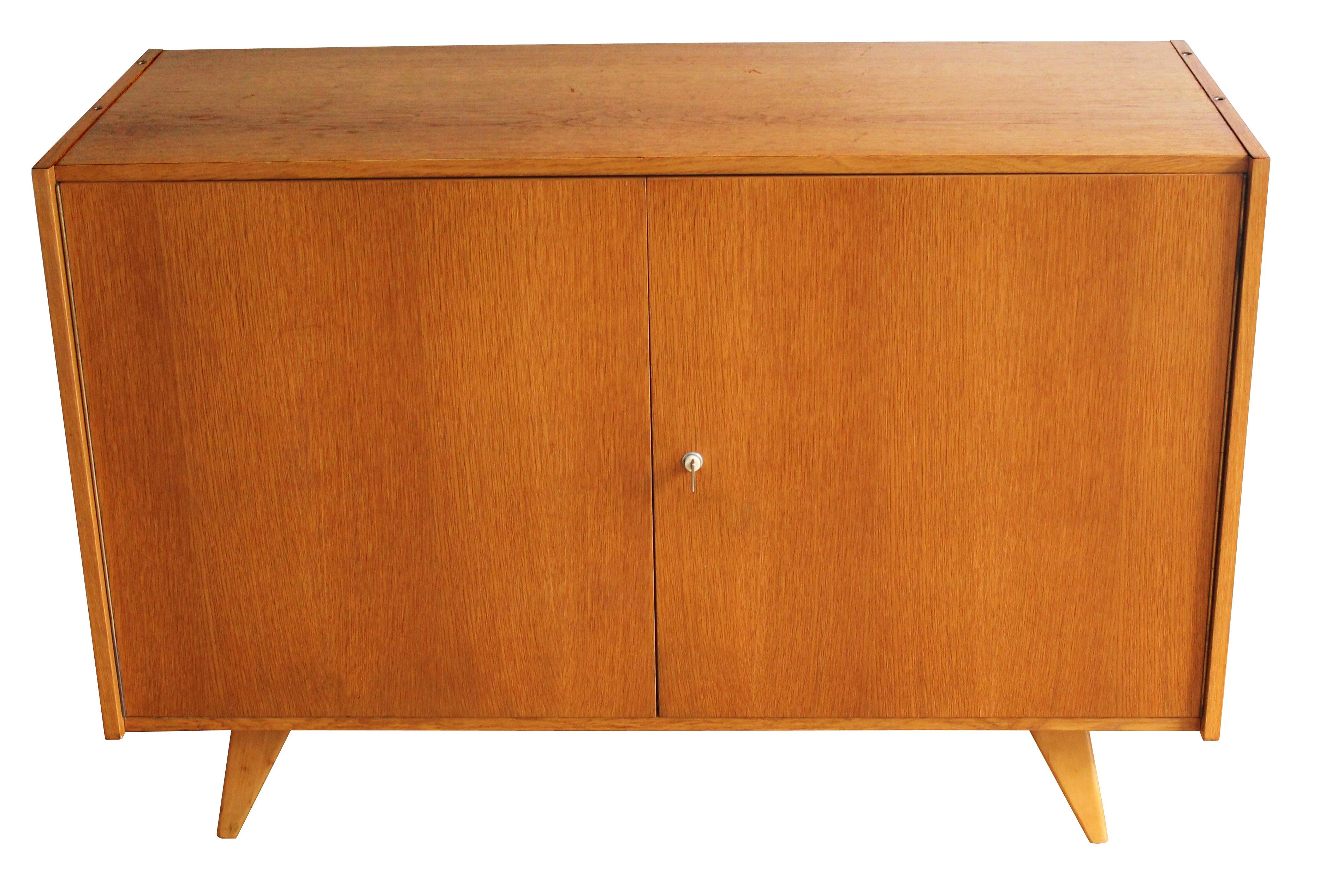 This U-450 oak sideboard was designed by legendary Czech furniture designer Jiri Jiroutek, and was part of the popular U collection manufactured by Interier Praha in the 1960s Czechoslovakia.

This piece perfectly embodies the elegance of the