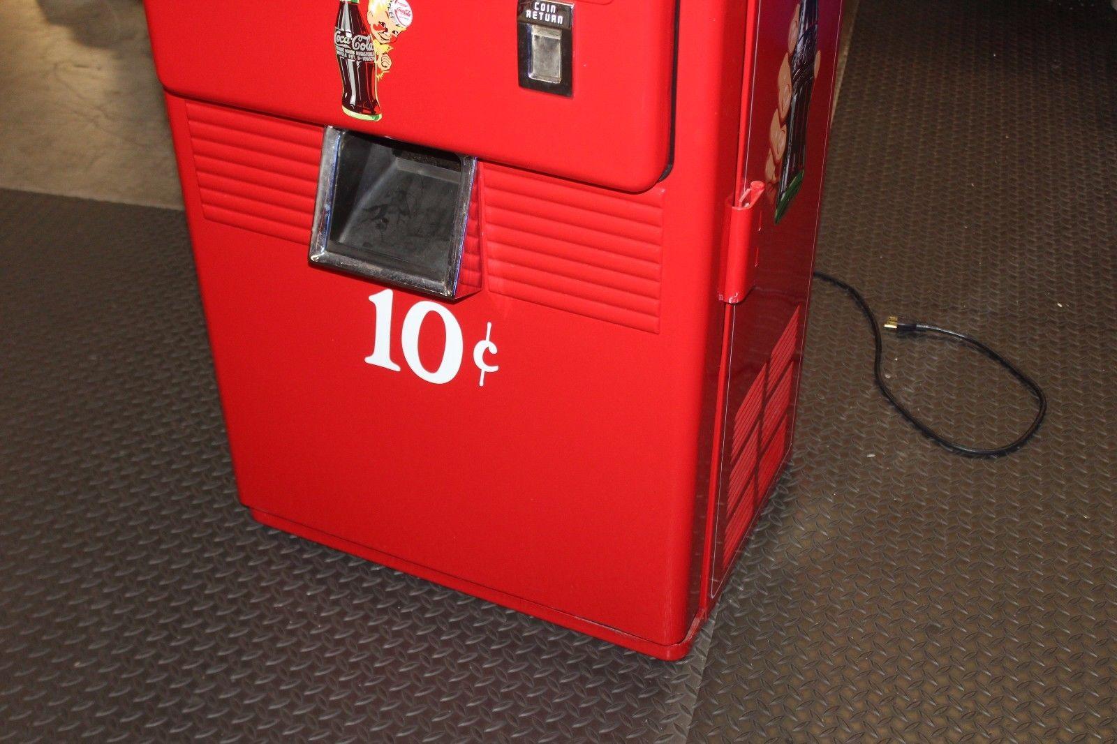 Beginning in 1956 when Coca-Cola changed its paint schemes, the new 42s were painted in a two-tone scheme. The body of the machine was red with a white top. In addition, the door embossing was eliminated and the Coke slogan on the side was no longer