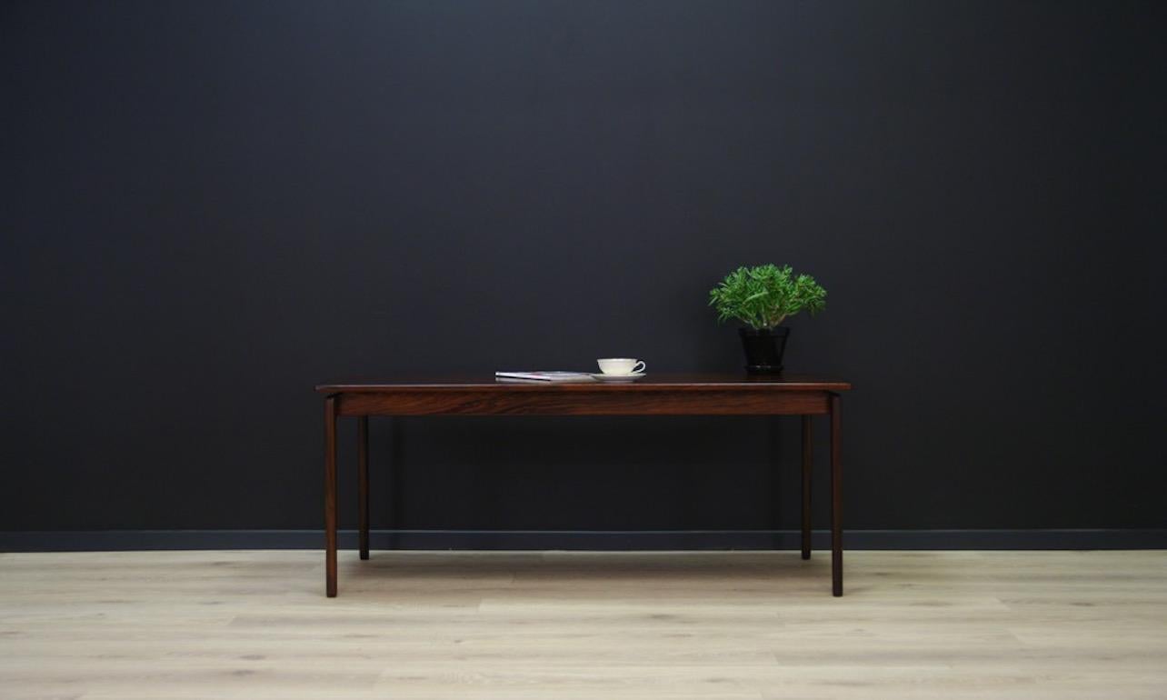 Original table from the 1960s-1970s, designed by Ole Wanscher, a Minimalist form refined in every detail. Tabletop covered with rosewood veneer, legs made of solid rosewood. Preserved in good condition (small dings and scratches) - directly for