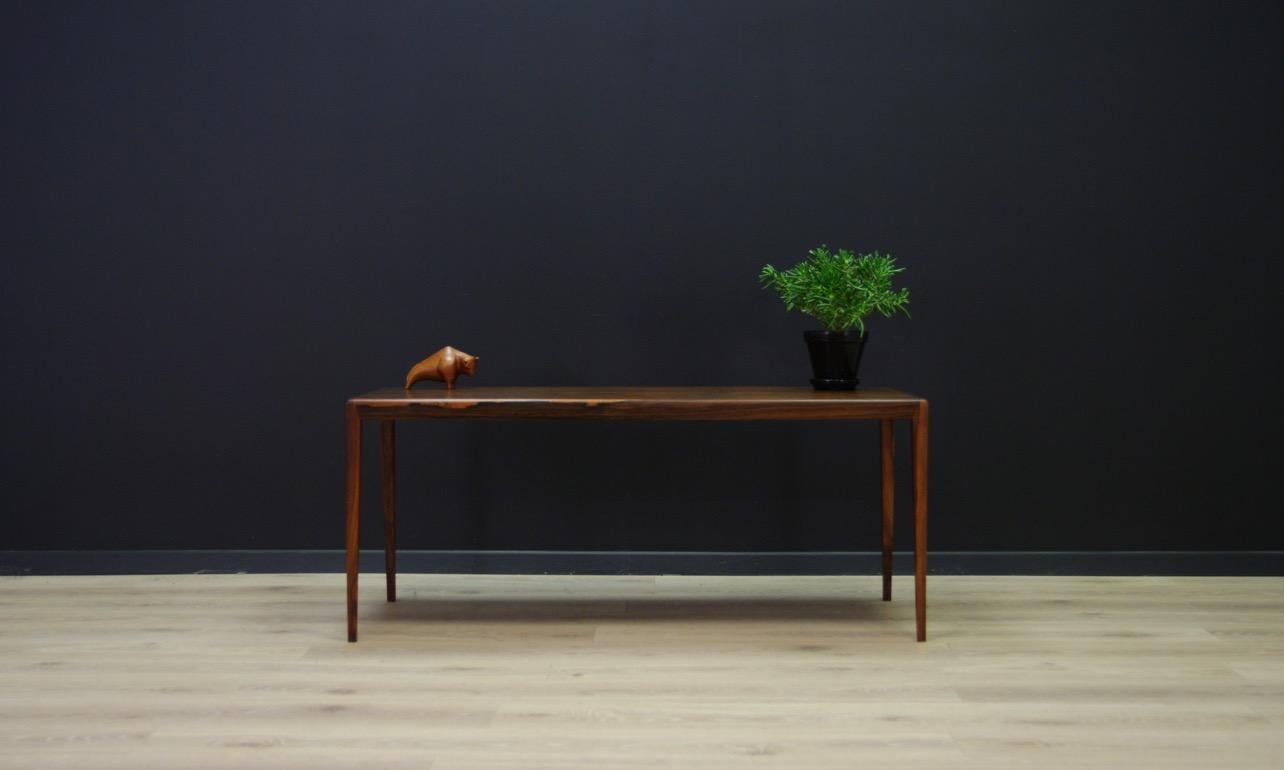 Brilliant table from the 1960s-1970s, Scandinavian design, a table covered with rosewood veneer. Legs made of rosewood. Preserved in good condition (small dings and scratches) - directly for use.

Dimensions: Height 50 cm table top 120 cm x 54.5