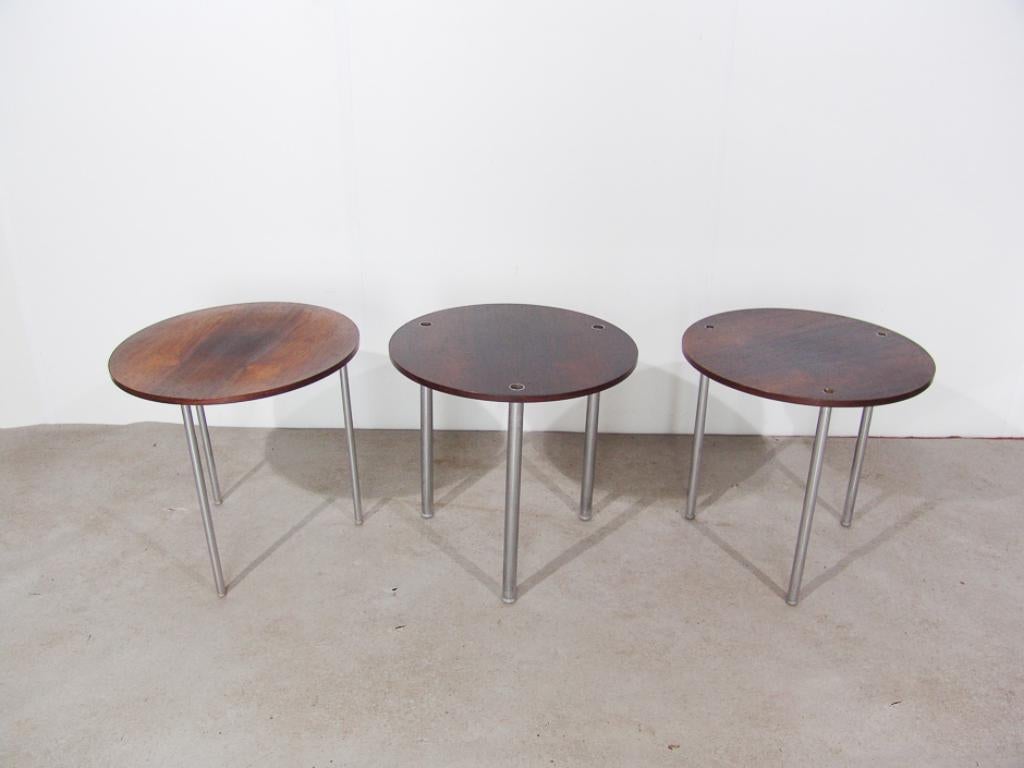 Very rare Poul Nørreklit for Petersen round nesting tables in rosewood

Chrome feet and rosewood veneer top. In good condition.

When stacked, the legs fit into each other.

Tables fit in each other.
Measure: Diameter 45 cm
Height 43 cm.