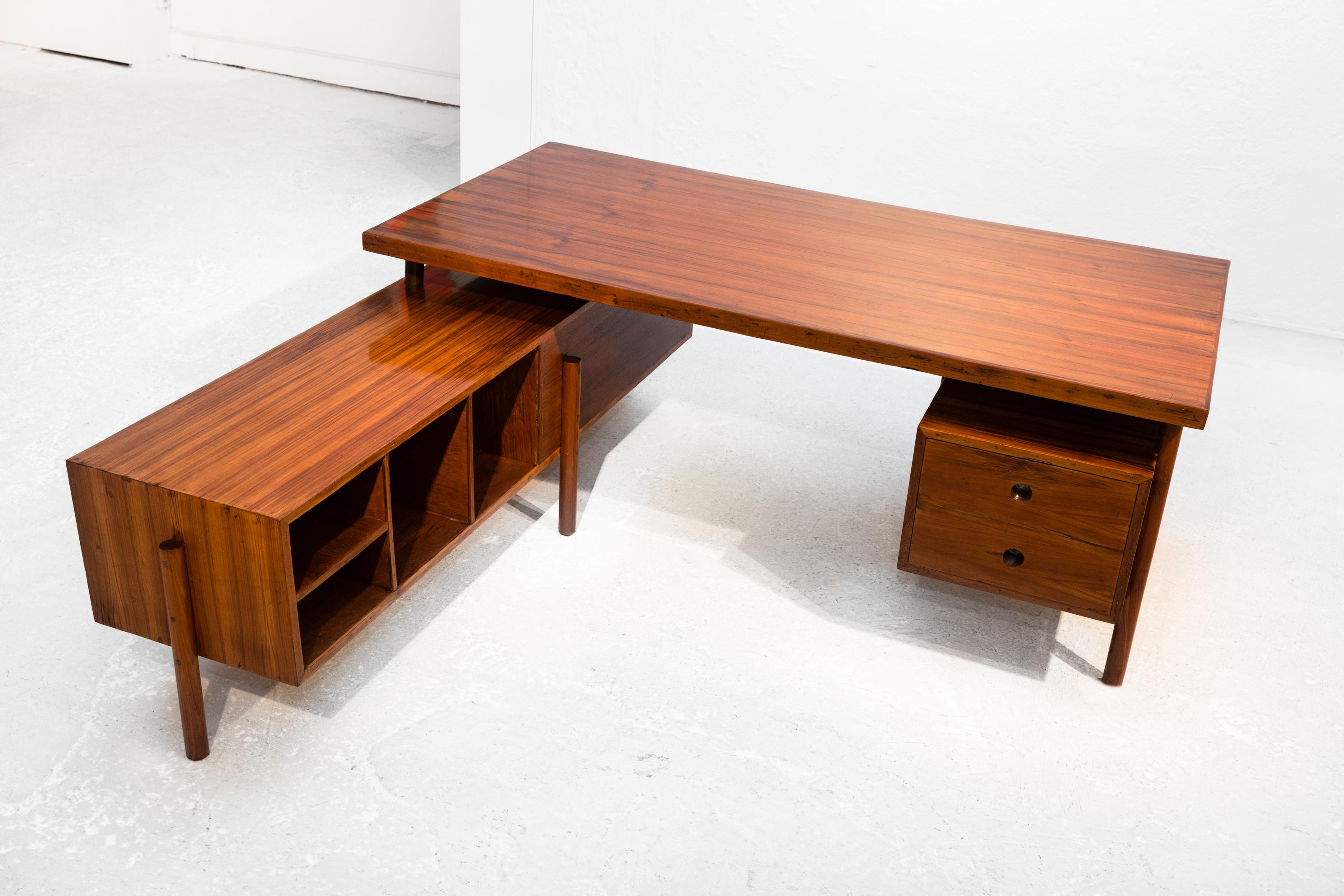 Large administrative desk by Pierre Jeanneret, original, 1957-58, PJ-BU-15-A. Solid teak and teak veneer, carefully restored. Designed for the administrative buildings of Chandigarh, India. 
The tabletop lies on two double-sided bases; one longer