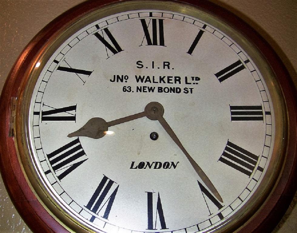 Really good British wall clock, made circa 1880 for use in a railway station house or a school house.

This is a superb clock!

Made by a well-known London maker, 'Jn. Walker Ltd' of 63 New Bond Street, London.

This is an 8 day fusee pendulum