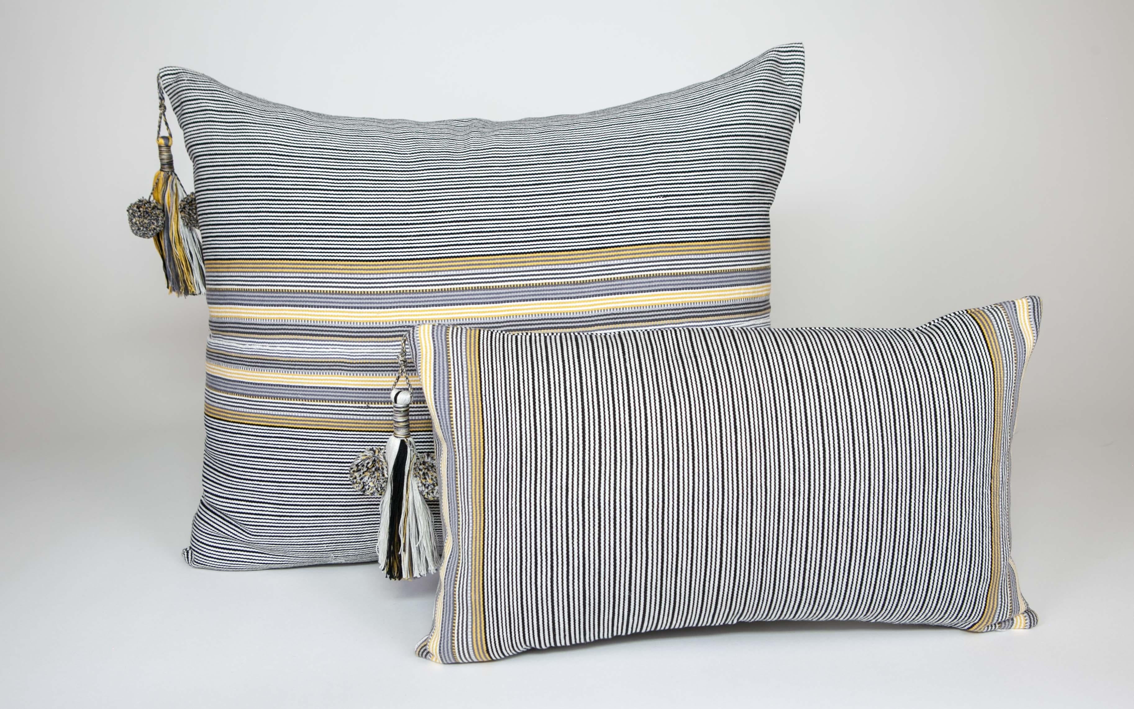 These delightful pillows are made in the Nachig municipality of Zinacantan, Chiapas, Mexico, an area that has been characterized by their finely woven striped ponchos and huipiles, these pillows are created on back strap looms using age old methods