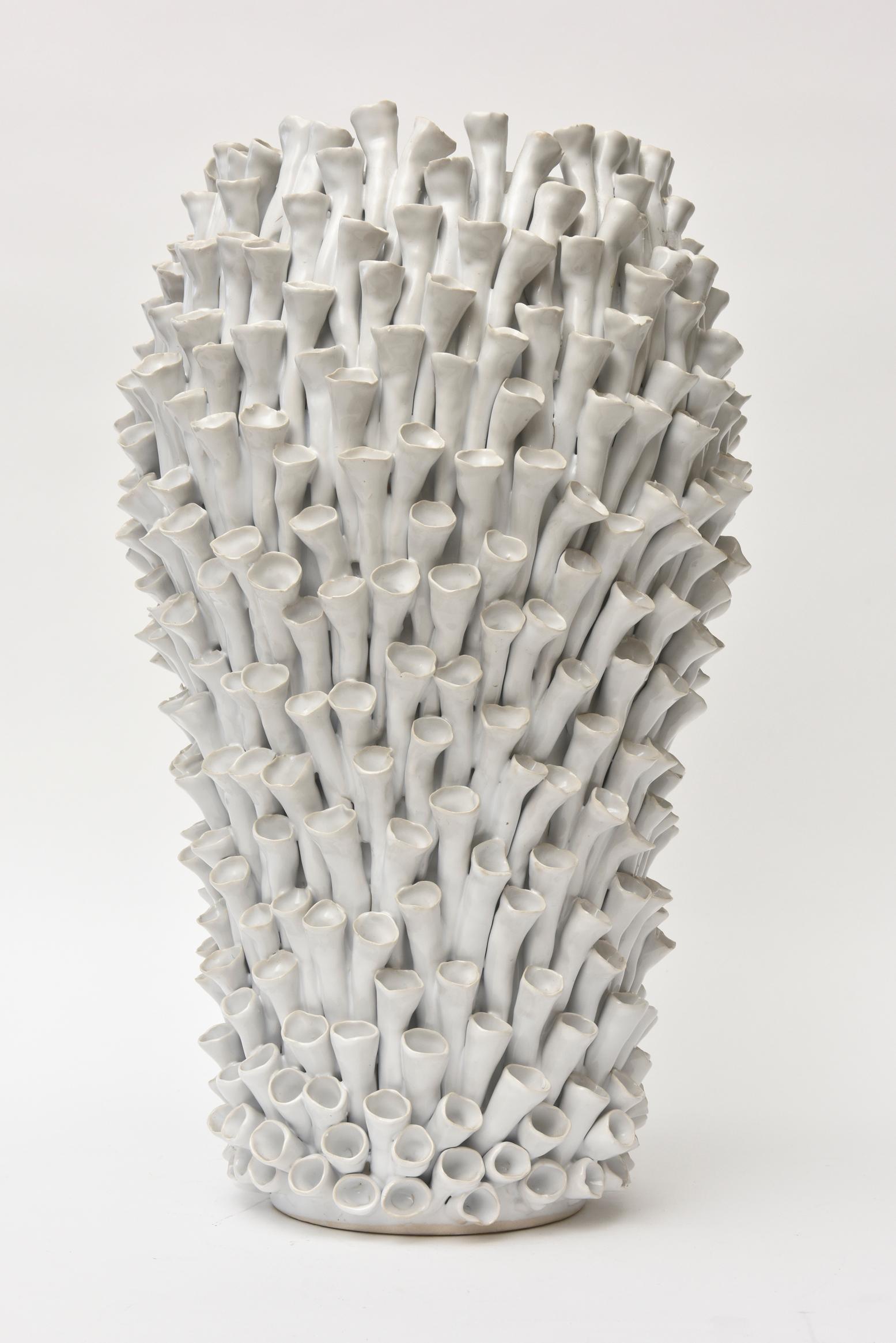 This amazing detailed organic modern white ceramic sculptural object/ vase/ vessel has hundreds of protruding coiled petals surround. There are no markings on it and would presume this is from the 1990s. There is an enormous amount of work involved
