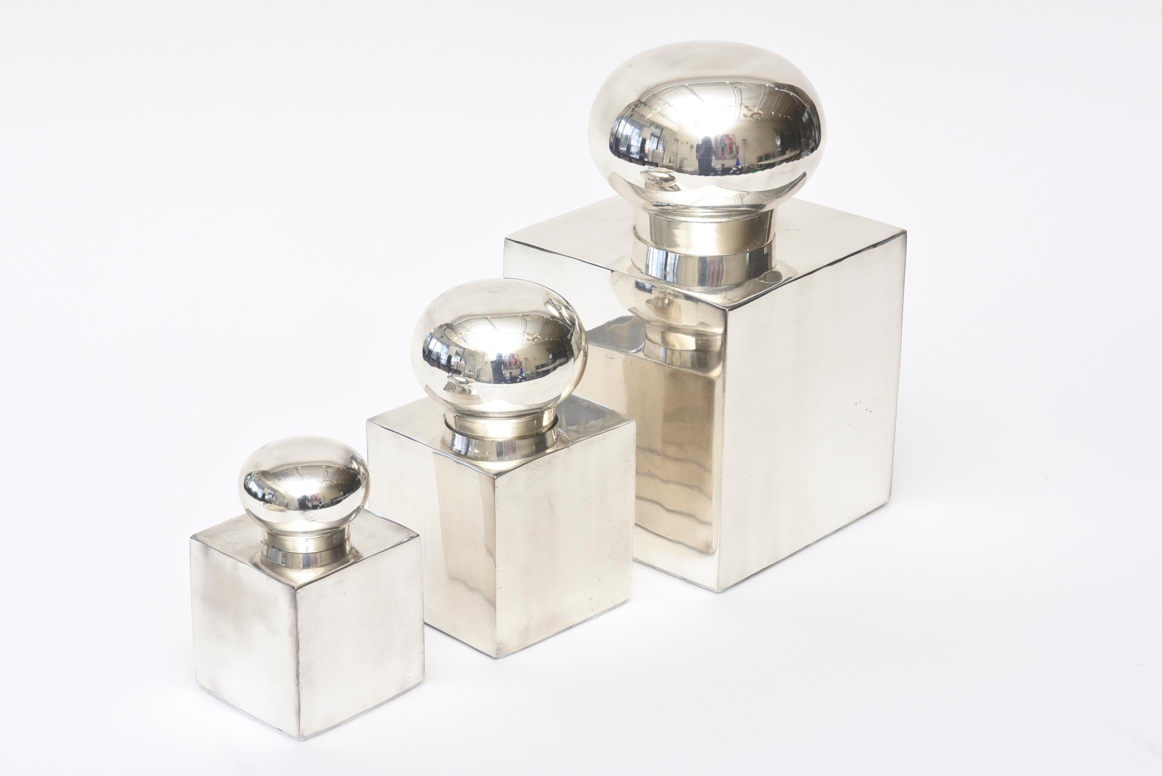 These set of 3 Italian vintage silver-plate square lidded boxes or objects or desk accessories all have a rounded ball lid that turns and comes off. They are 3 varying heights with the largest being 9.5