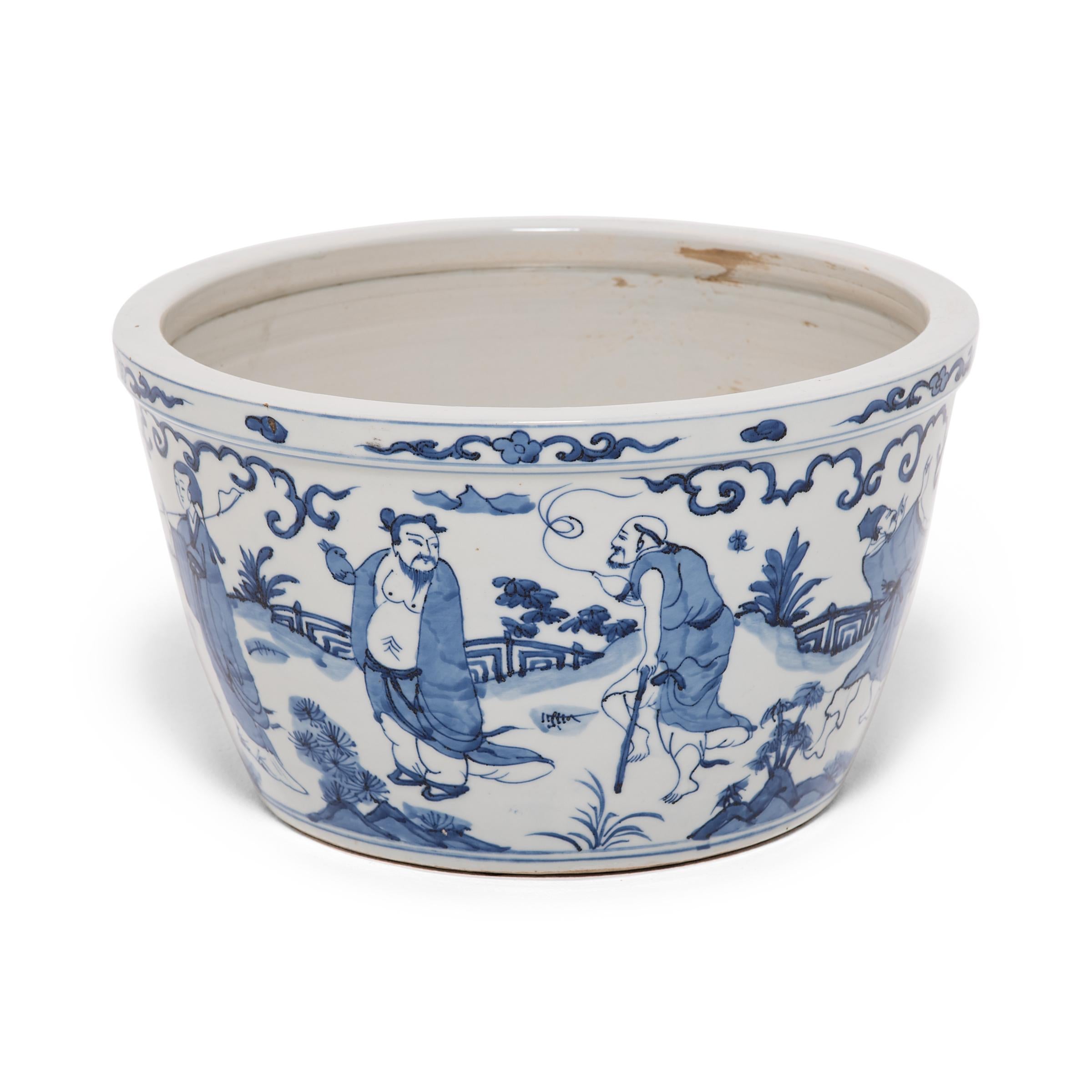 Designed for cultivating goldfish, charmed pets that created good feng shui, this fish bowl is a stunning example of the art of blue-and-white porcelain. Perfected by Chinese artisans over centuries, this ceramic tradition exploits the rich blue of