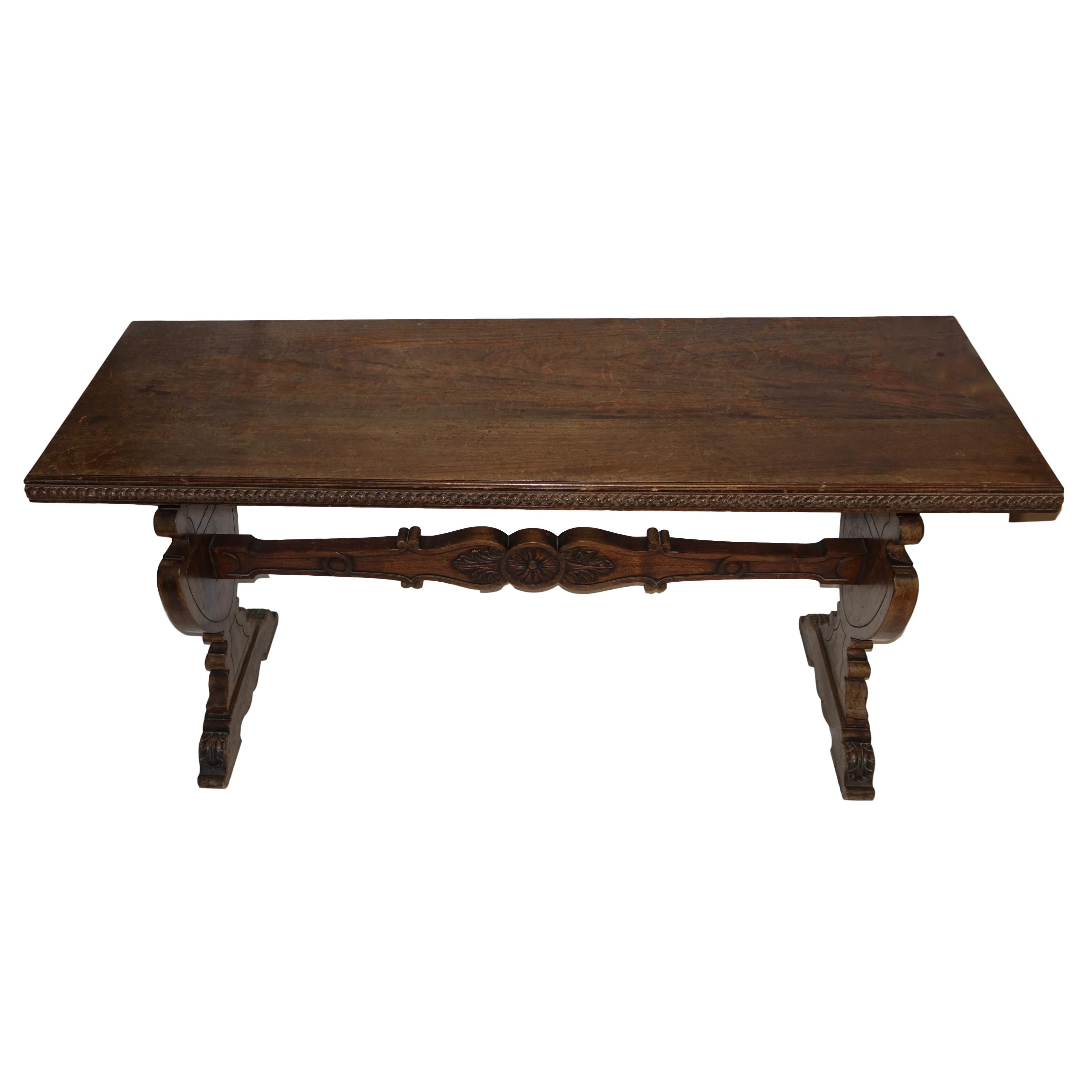 A circa 1920s Spanish carved walnut console table.

Measurements:
Height 31?
Width/length 59?
Depth 19?
