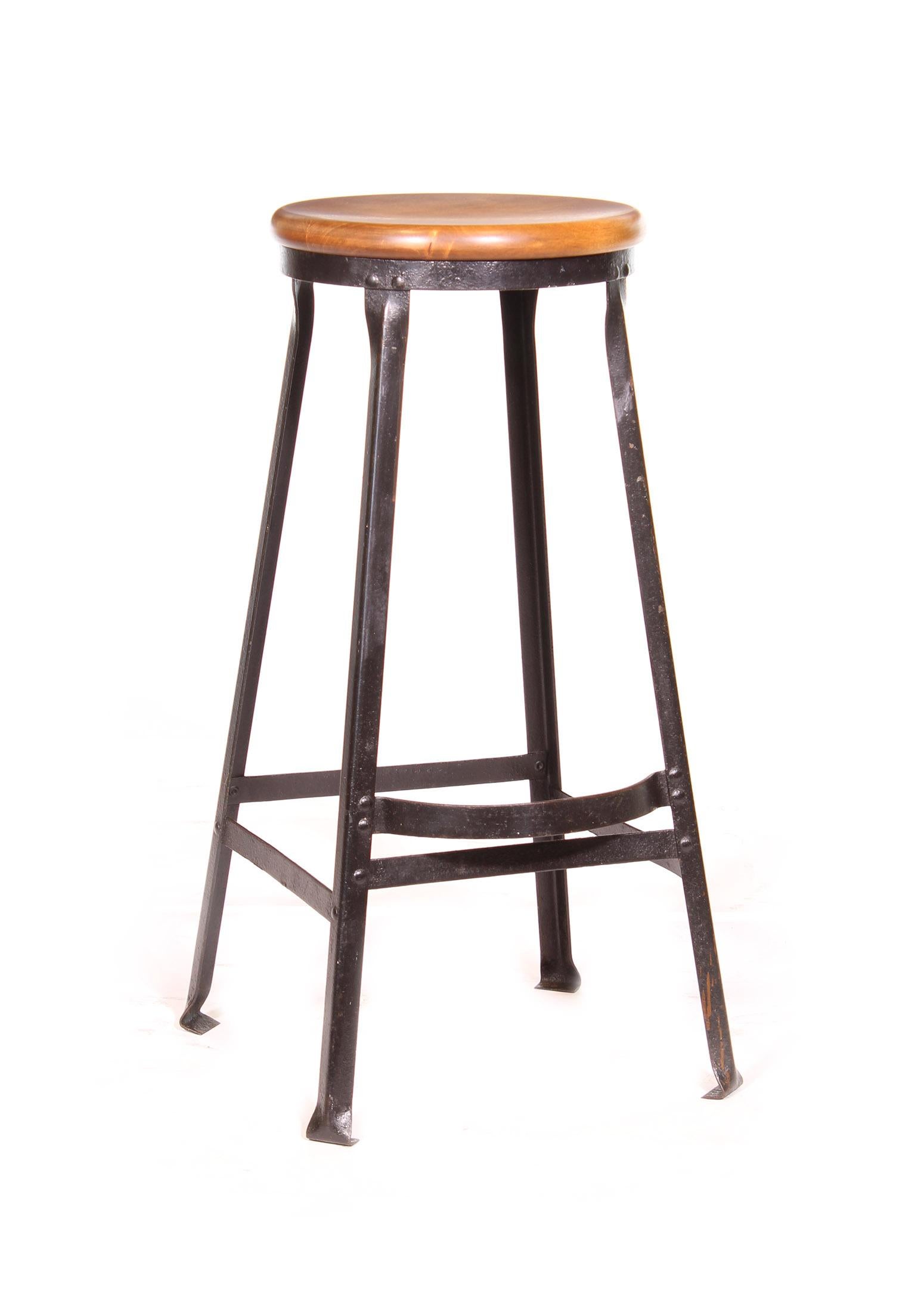 Vintage authentic industrial factory shop / bar / kitchen counter stool. Black worn steel with footrest and maple seat. 30