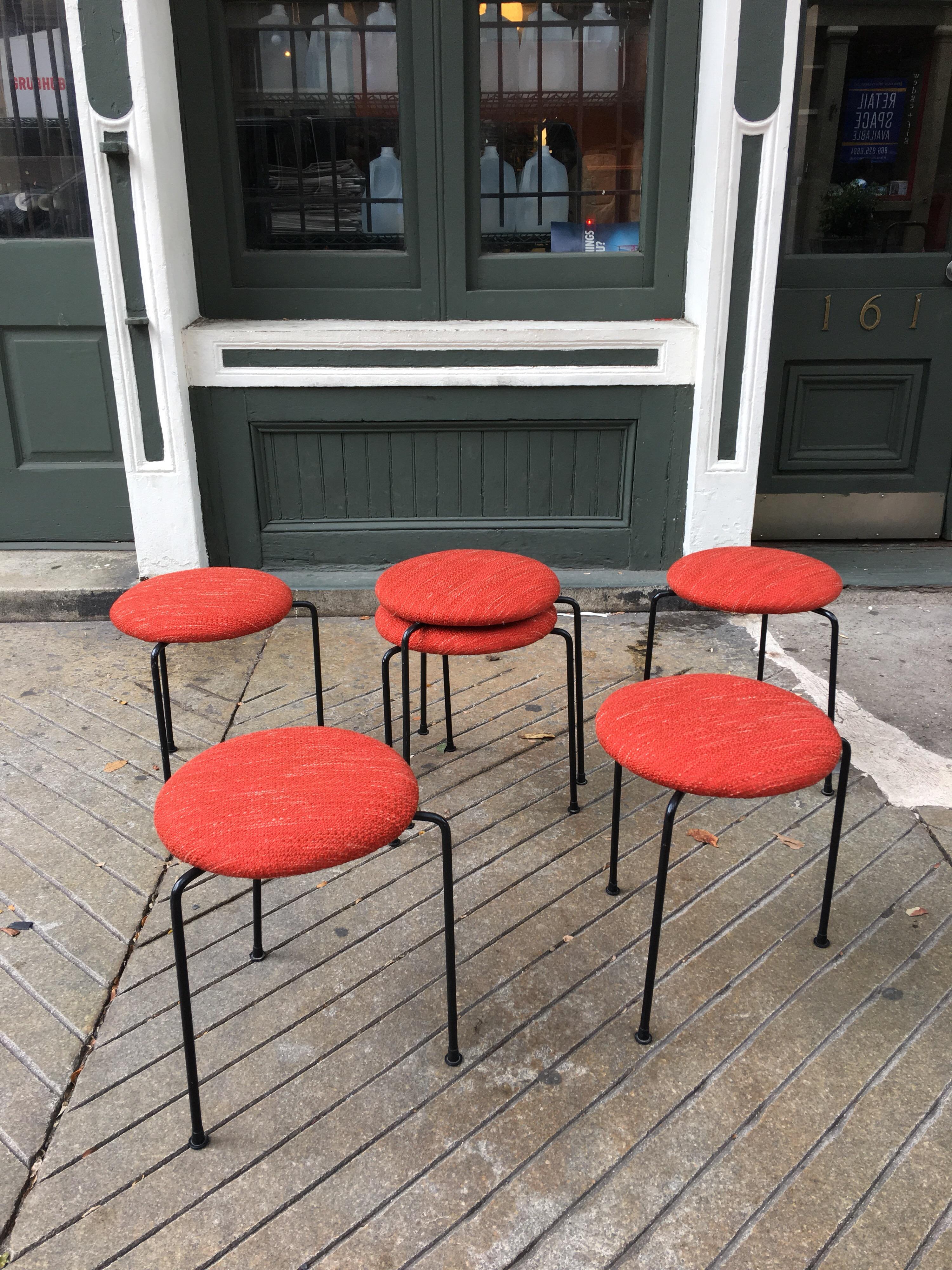 Clifford Pascoe stacking tripod stools in Knoll Riving ton red fabric seats and all their original plastic slip on feet.