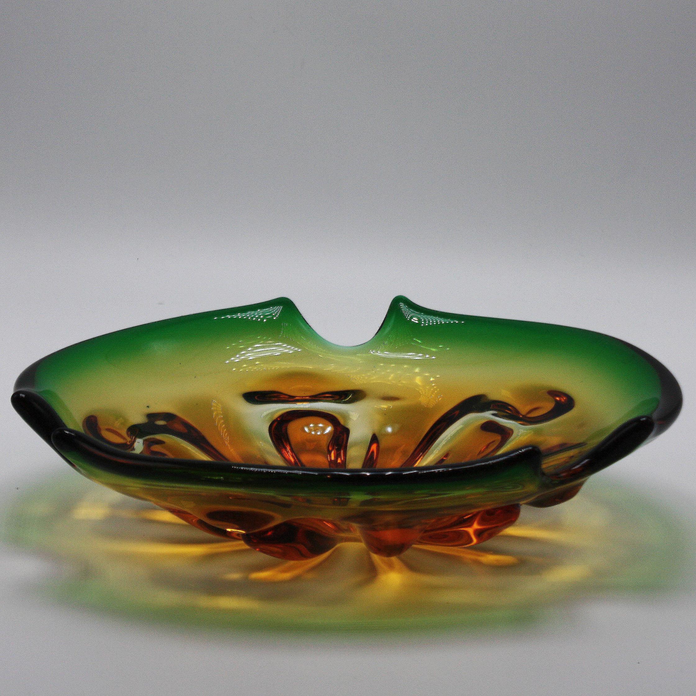 Amber and Green Murano glass bowl, circa 1960
Measures: 10” diameter X 2 1/2” height.