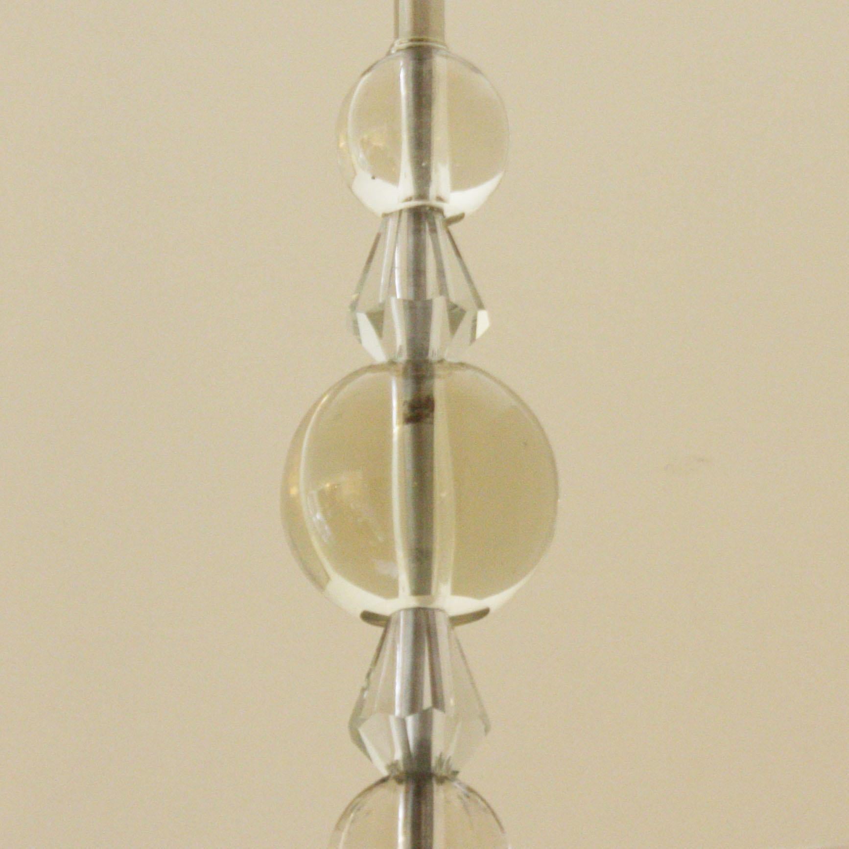 French chandelier in the style of Jacques Adnet, circa 1940
Measures: 21” diameter X 23” height.