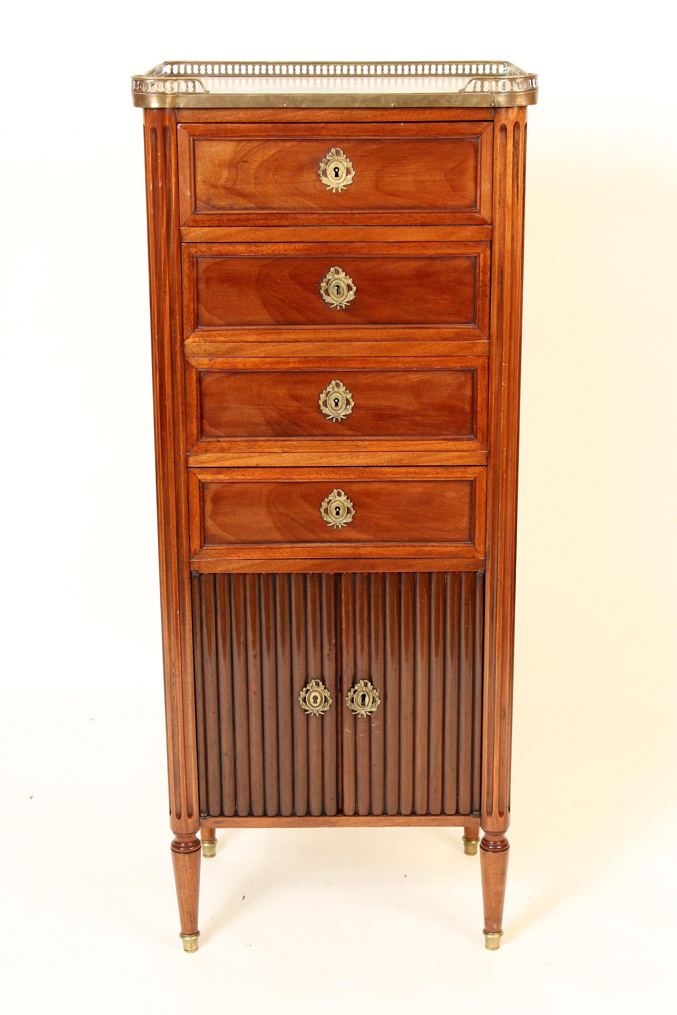 Louis XVI style mahogany lingerie chest with brass escutcheons, brass gallery, marble top and doors on the bottom, circa 1920. Nice quality mahogany used on this chest.
