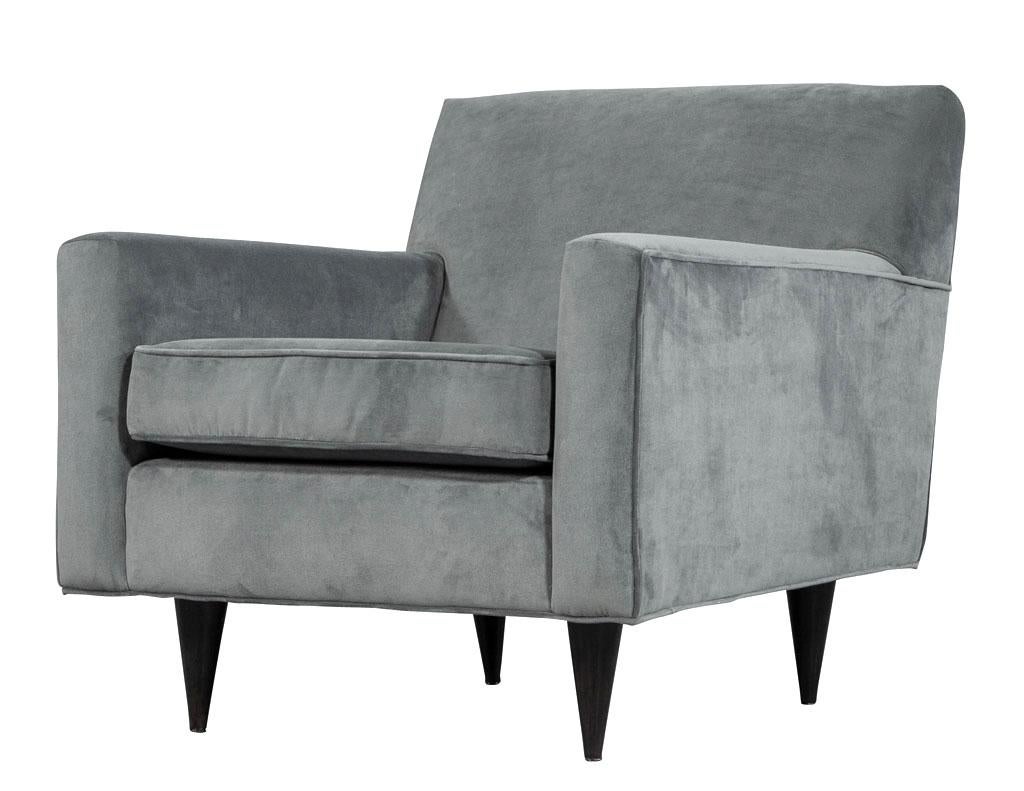 Pair of Mid-Century Modern upholstered parlor arm living room chairs. This pair of arm chairs are authentic to midcentury design. With organic, clean lines and stylish functionality these chairs are of a class that will continue to rise and