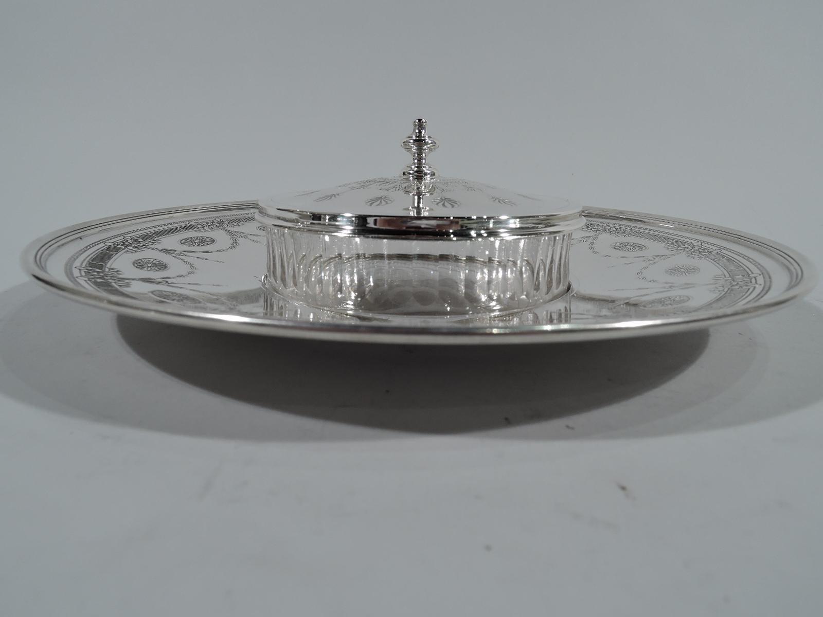 Edwardian sterling silver and glass caviar dish. Clear glass bowl with straight sides and tubular fluting. Cover sterling silver with vase finial and stylized acid-etched ornament. Bowl set in well of sterling silver Stand with wide shoulder and