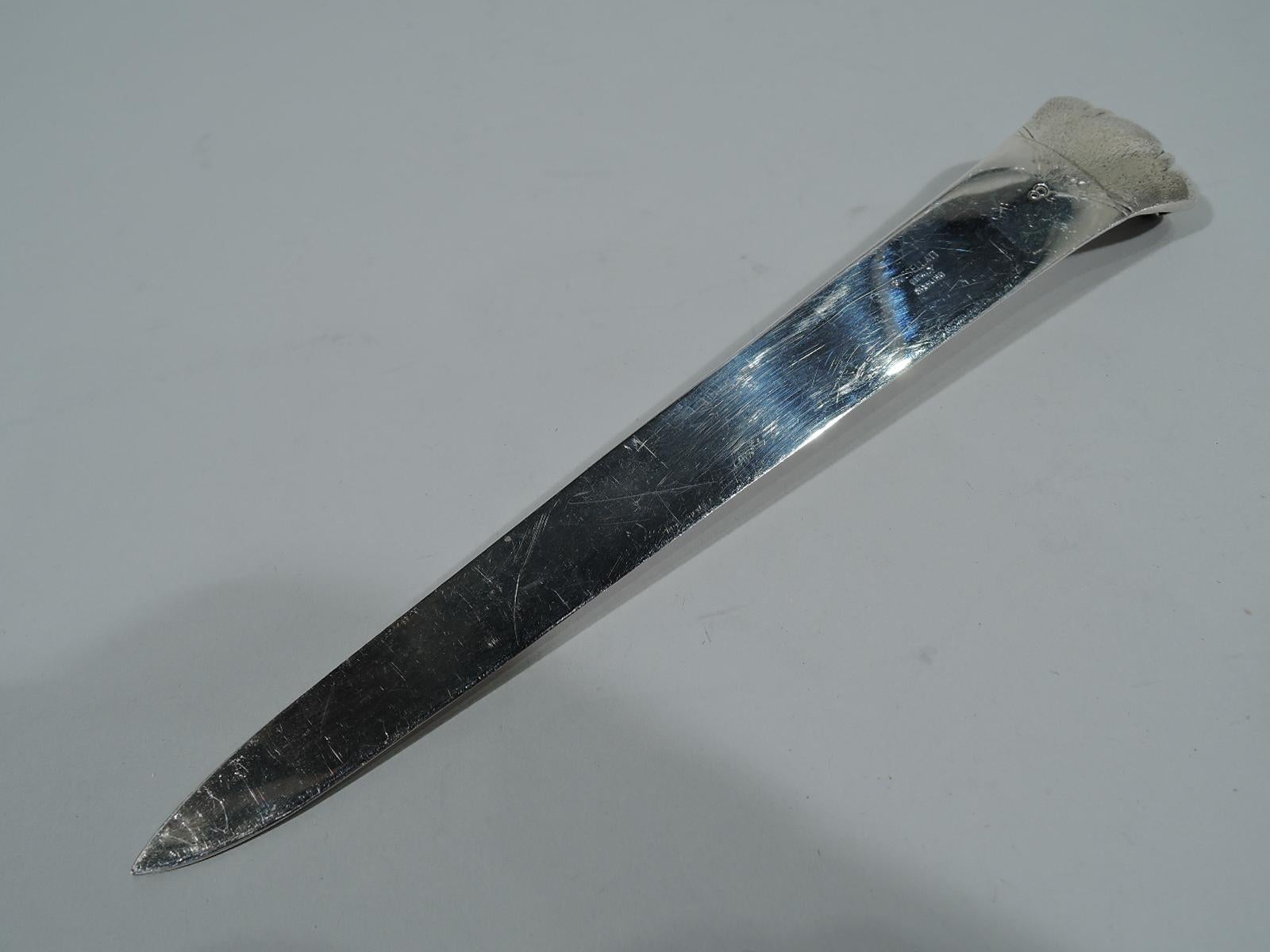 Chic sterling silver letter opener. Made by Buccellati in Italy. Tapering blade and dynamic scrolled terminal with striation and feathering. A smart desk accessory for paying bills with panache. Hallmark and no. 8. Weight: 2.5 troy ounces.