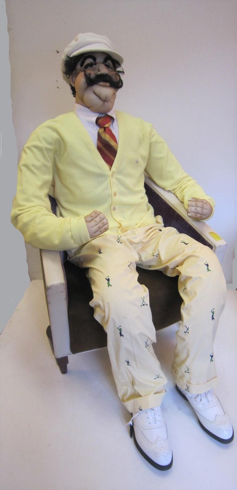 A fabulous and amusing life size soft sculpture of a sporty man dressed as a golfer, realistically portrayed with original garb.
 The golfer wears all authentic clothing, Arnold Palmer size 46 XL sweater, terry cloth cap, shirt, tie, yellow cuffed