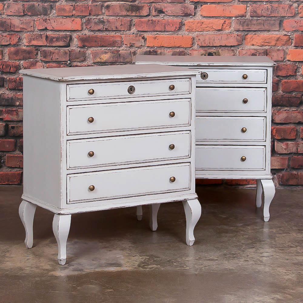 This pair of small matching chest of drawers is a special find. The abbreviated size with brass knobs and cabriole legs add to their appeal and would make an ideal pair of nightstands or alongside a sofa as end tables. It is the slightly distressed