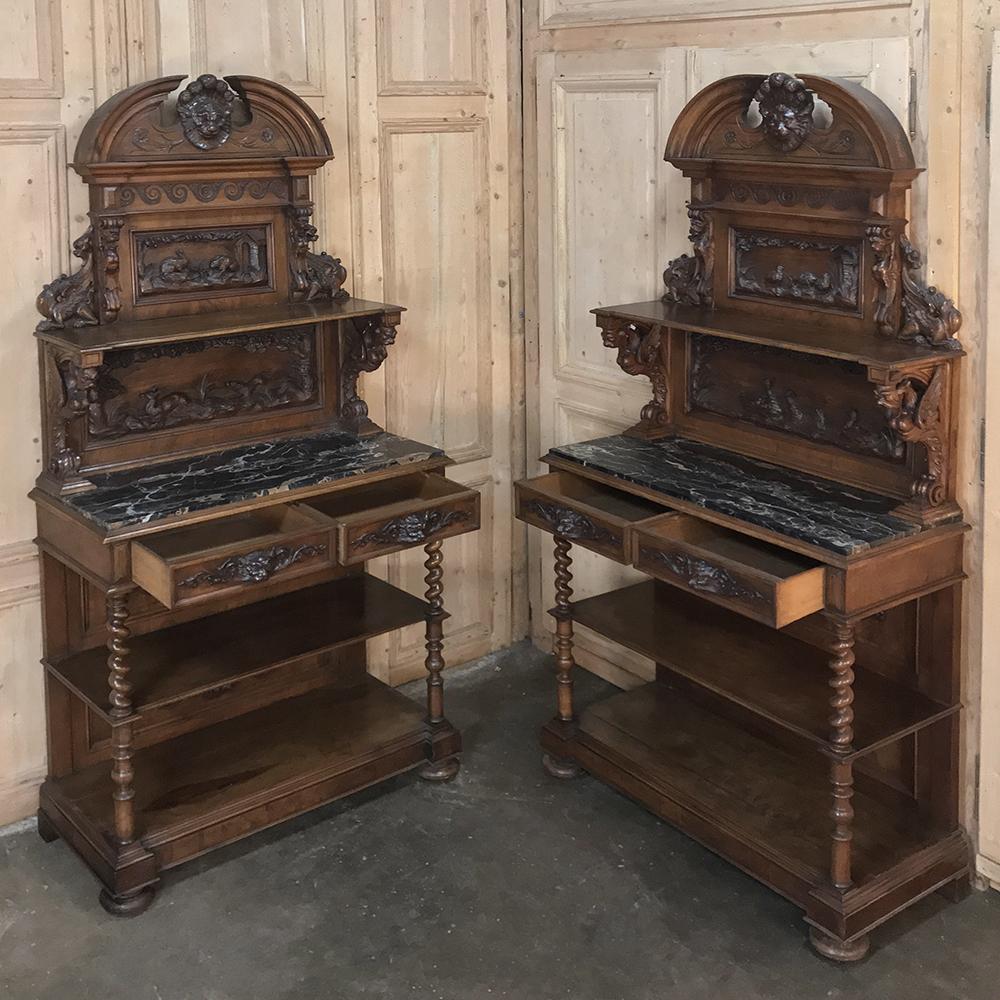 Pair of 19th century Italian Renaissance walnut marble-top hunt buffets are an extraordinary example of the master artisanry just before the turn of the century in Italy! Hand-sculpted from select walnut, each features facing arches on top flanking