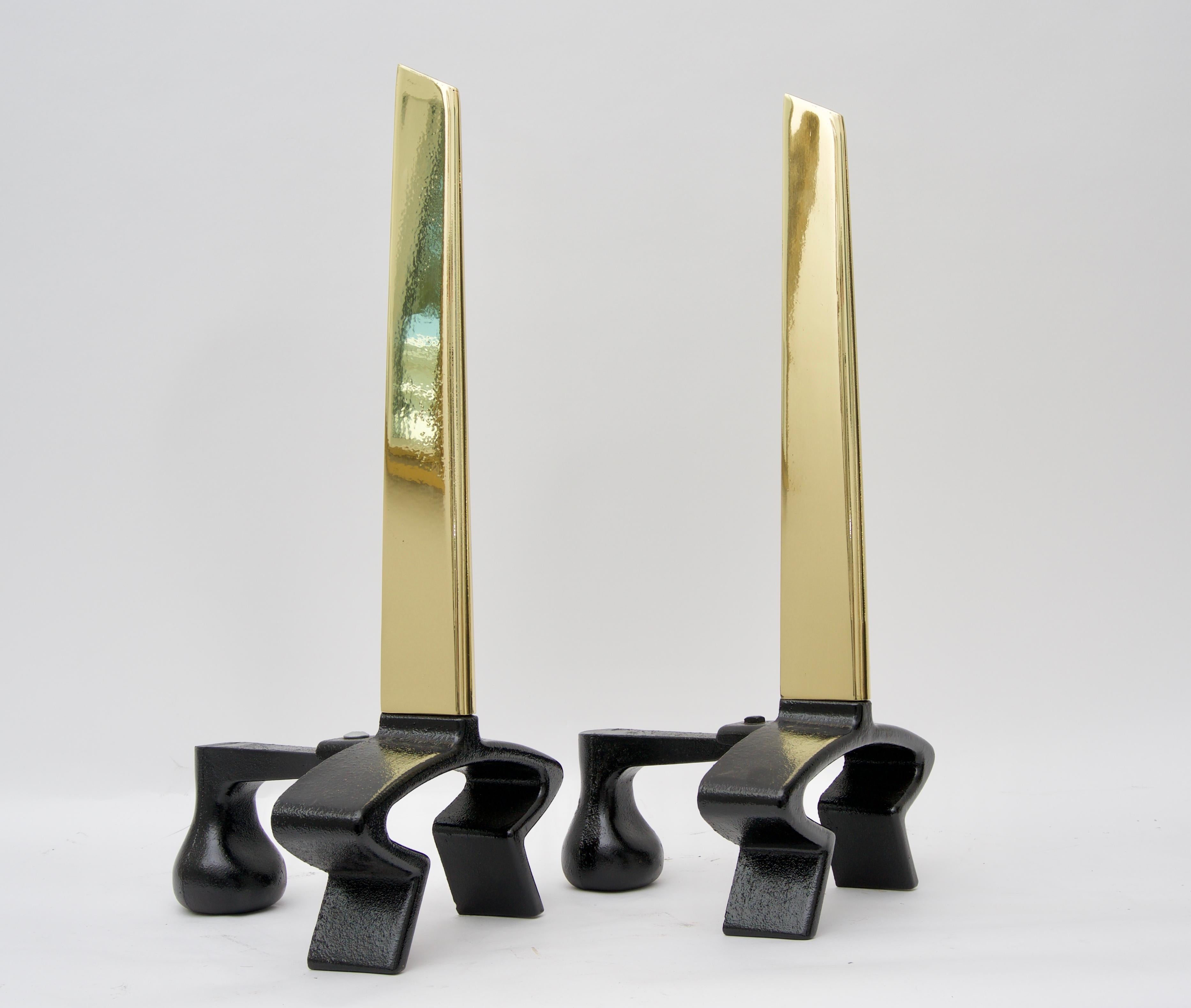 This stylish Mid-Century Modern set of andirons in polished brass and black iron date to the 1950s and have been professionally polished and will make a great look for your fires this winter season.