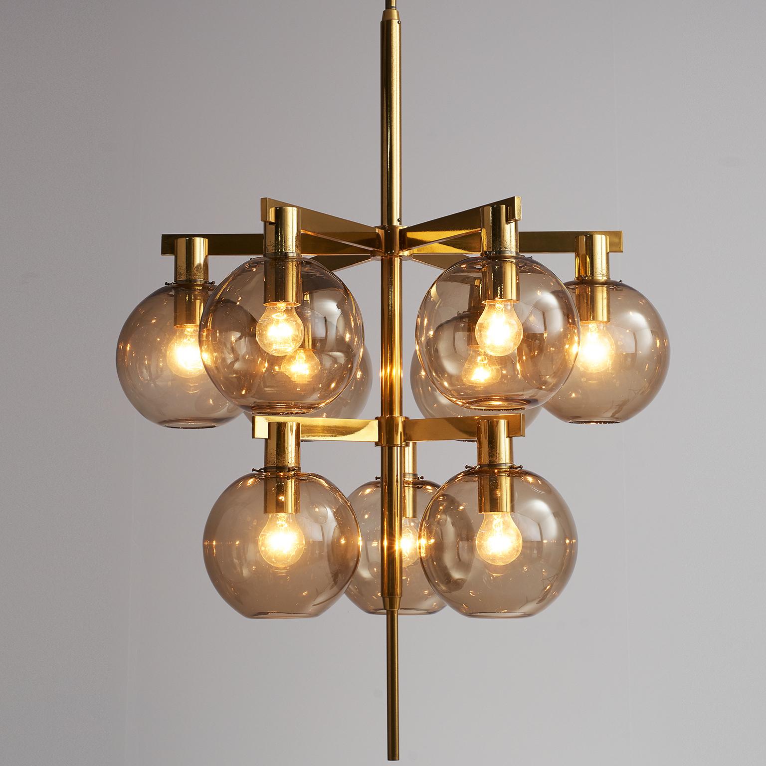 Hans-Agne Jakobsson, ceiling lamp model T-348/6 'Pastoral', brass and glass, Sweden. 

This chandelier is designed by Hans-Agne Jakobsson. The chandelier is produced by Hans-Agne Jakobsson AB in Markaryd, Sweden. The brass frame has nine brass