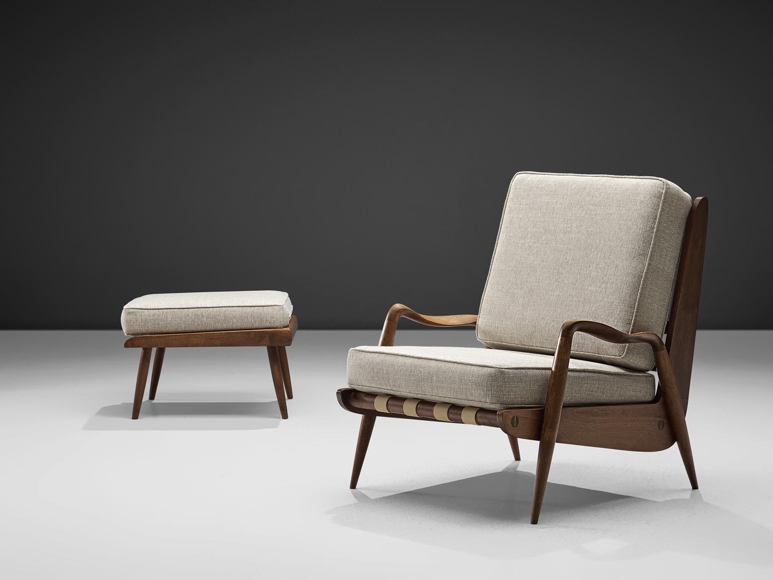 Philip Lloyd Powell, lounge chair with ottoman, american walnut and grey fabric, United States, 1960s. 

This sculptural armchair and matching ottoman are executed in American walnut and recently upholstered thick grey fabric. It is extremely rare