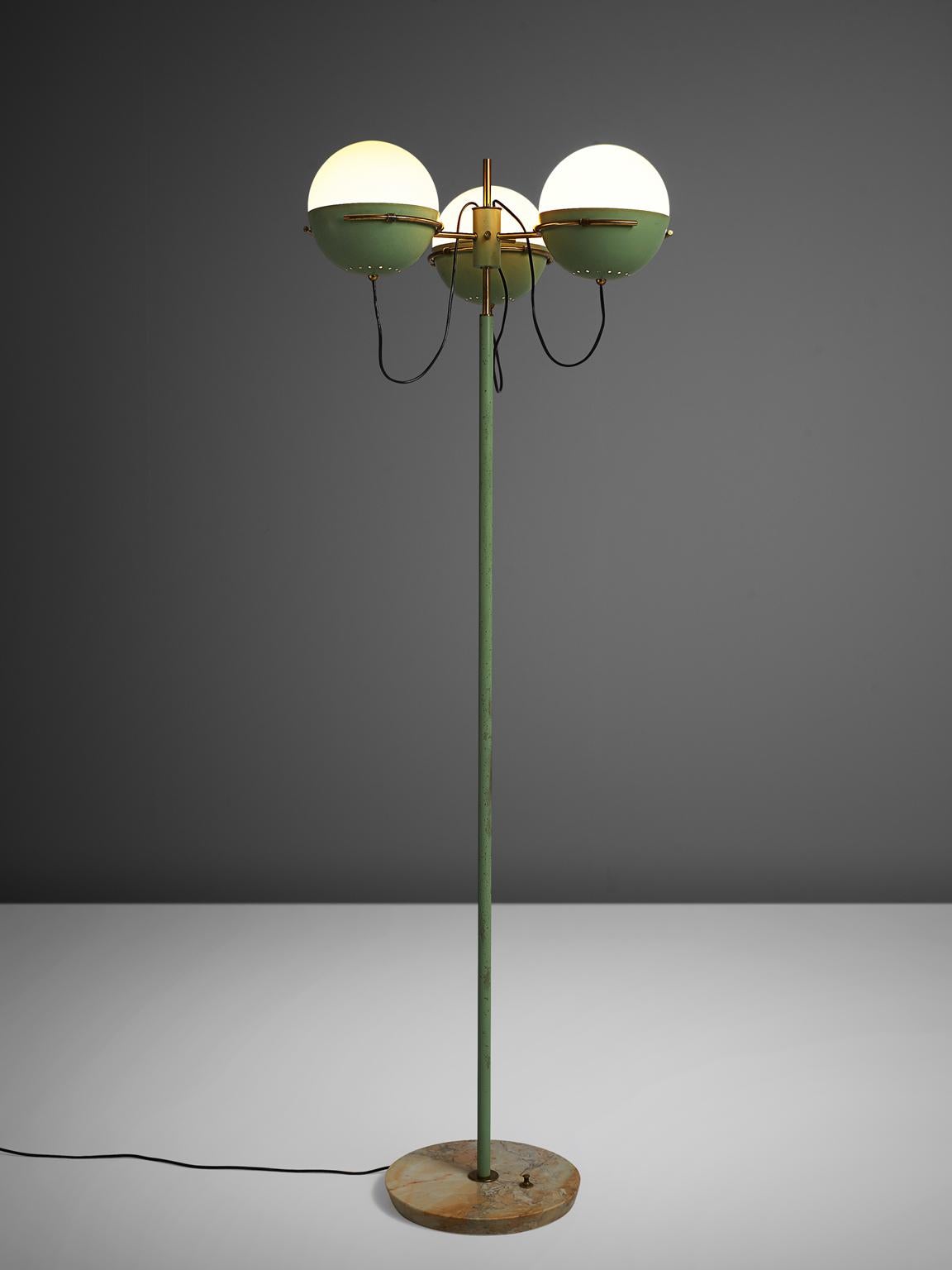 Floor lamp, marble, metal, brass, Italy, 1950s. 

Elegant standing floor lamp is designed in the style of Stilnovo Italy. The mint green shades goes very well with the brass and white globes. The base is in marble, and finished with stunning brass