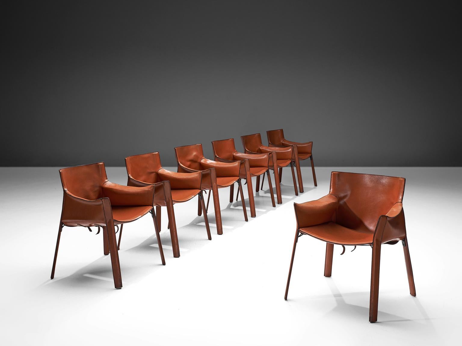 Giancarlo Vegni for Fasem, set of seven P90 chairs, terracotta leather and metal, Italy, 1970s.

These armchairs feature two synthetic resin ferrules at the tip of the uprights of the back, minimal padding, which supports the lower back an a