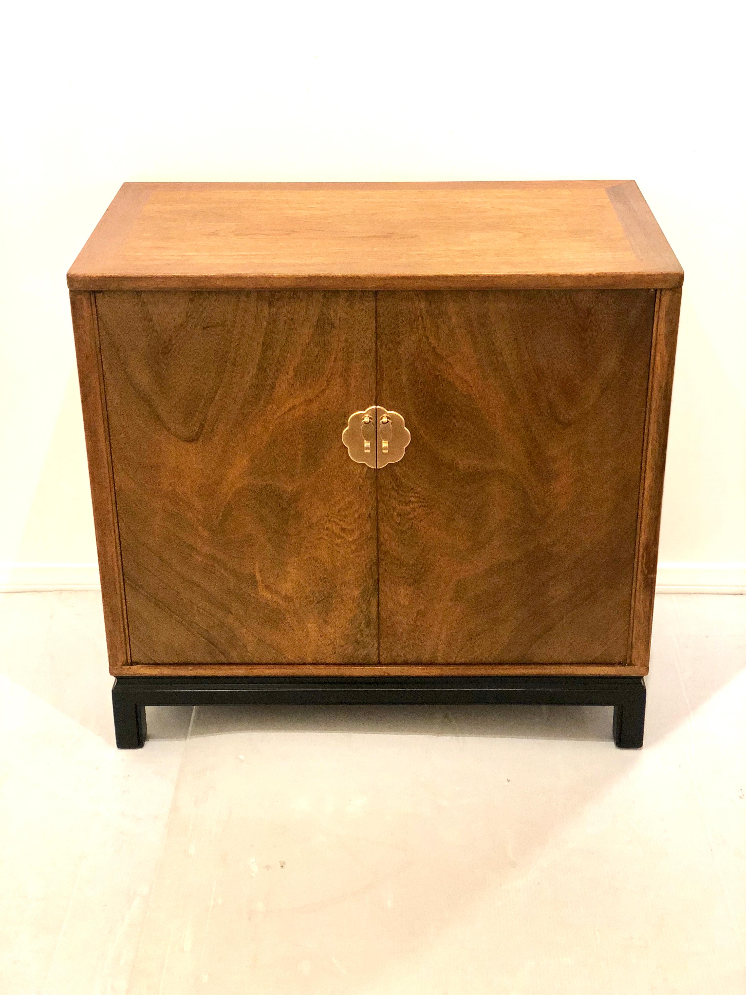 Beautiful and versatile double door cabinet by Lanstrom furniture, great quality double drawers freshly refinished in mahogany with black lacquer base, and polished brass handles, circa 1950s goes well with midcentury or Hollywood Regency.