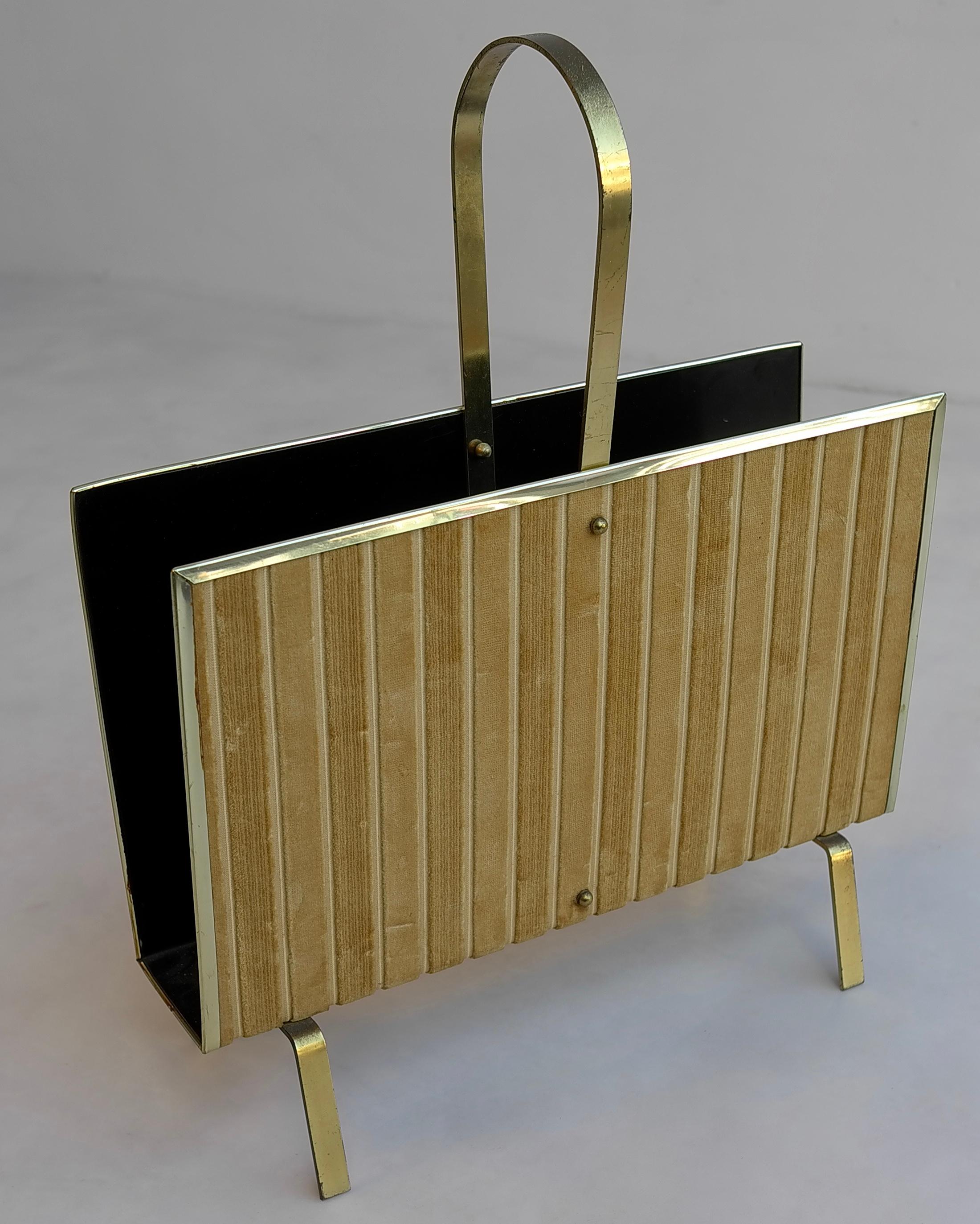 Velvet magazine rack with decorative brass feet gold color plastic rim and brass handle for ease of carrying.