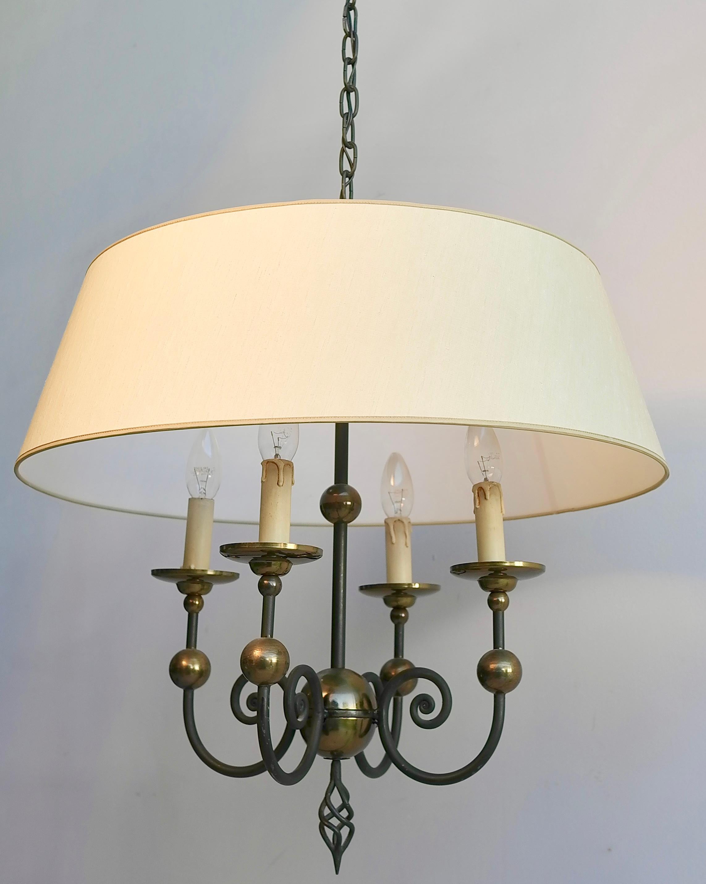 French midcentury wrought iron chandelier with brass balls and silk hood.