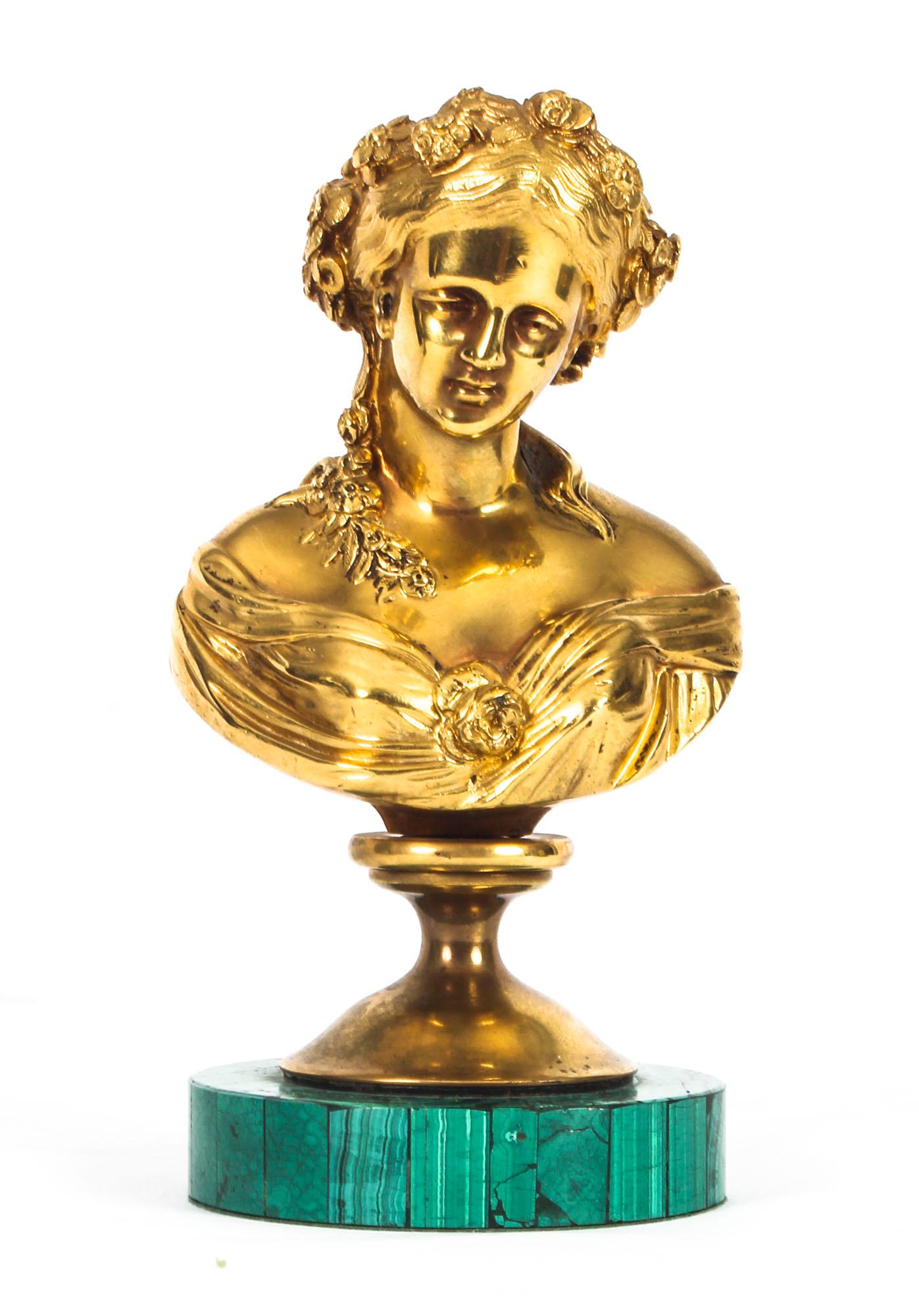 This is a wonderful antique French ormolu and malachite mounted portrait bust of a young maiden, circa 1870 in date.
 
This finely cast ormolu bust features a young maiden dressed in classic attire, her hair is tied with flowers and she is gazing
