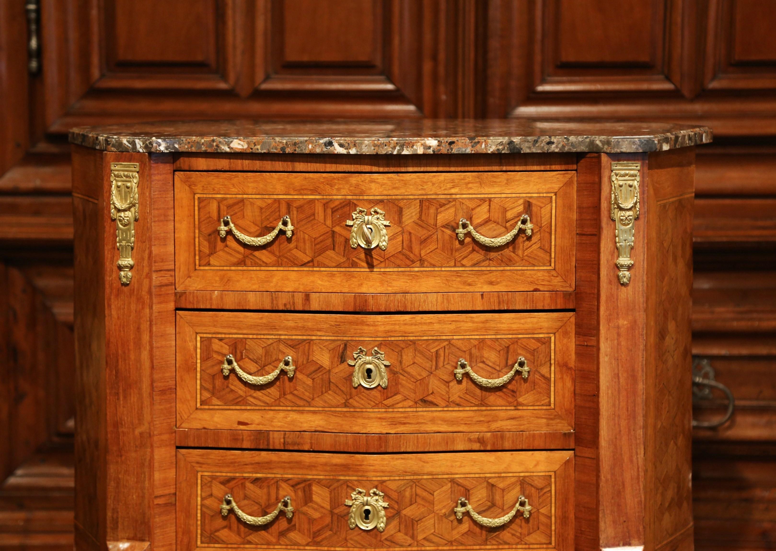 This elegant fruitwood commode is a versatile side cabinet for any room. Crafted in France, circa 1900, this sophisticated, detailed chest could be used as a bedside table, a side table beside an armchair, or as a small chest in a powder room or an