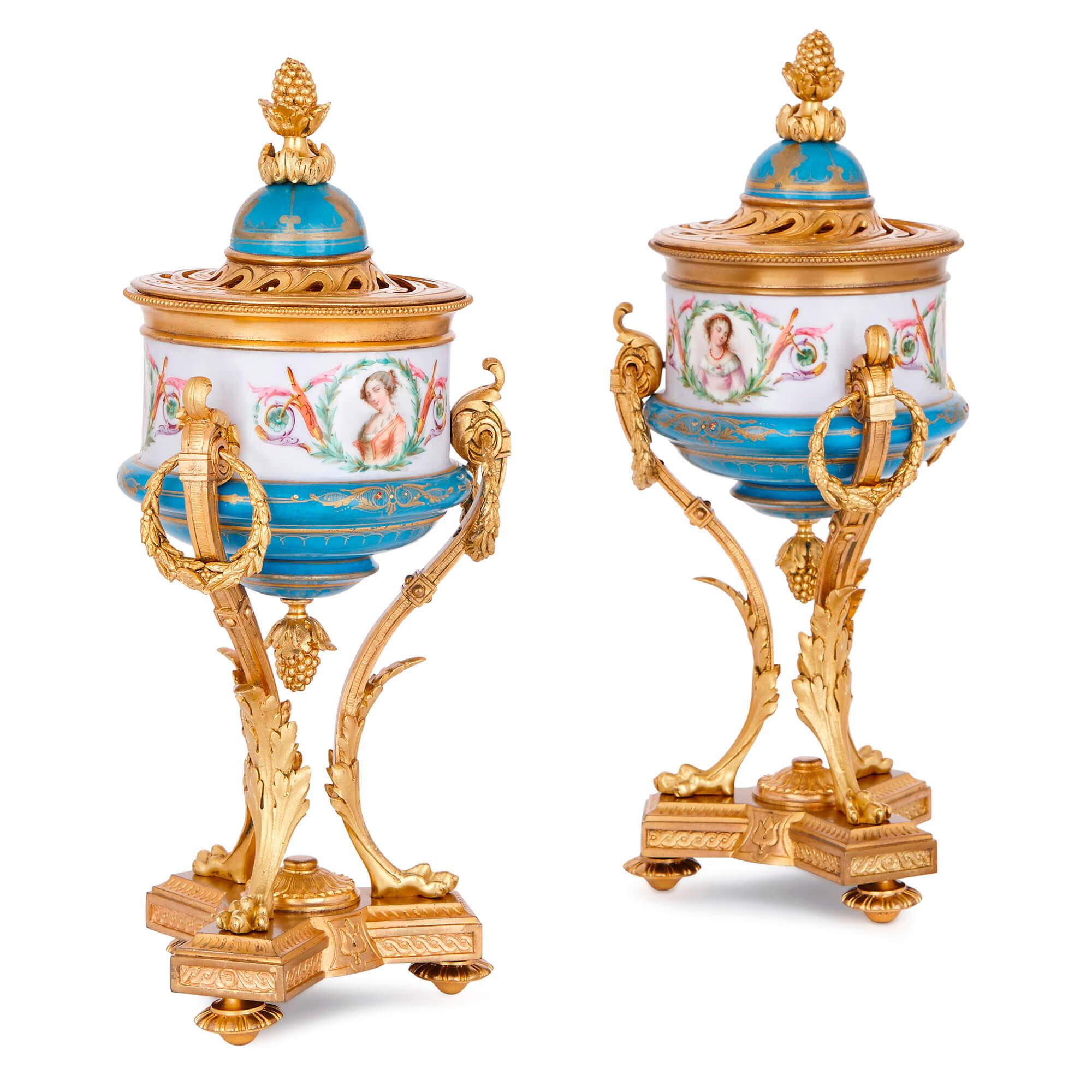 Crafted from fine porcelain in the Sèvre style and set into opulently-decorated gilt bronze frames, these unusual Belle Époque era vases will make delightful additions to an interior setting.

Each porcelain vase features expertly-painted busts of