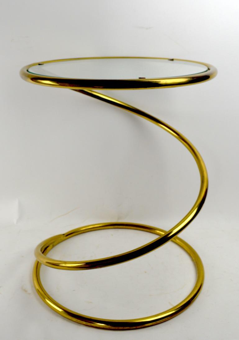 Unusual brass version of the classic coil spring glass top table attributed to Pace. Nice original condition, clean, ready to use.