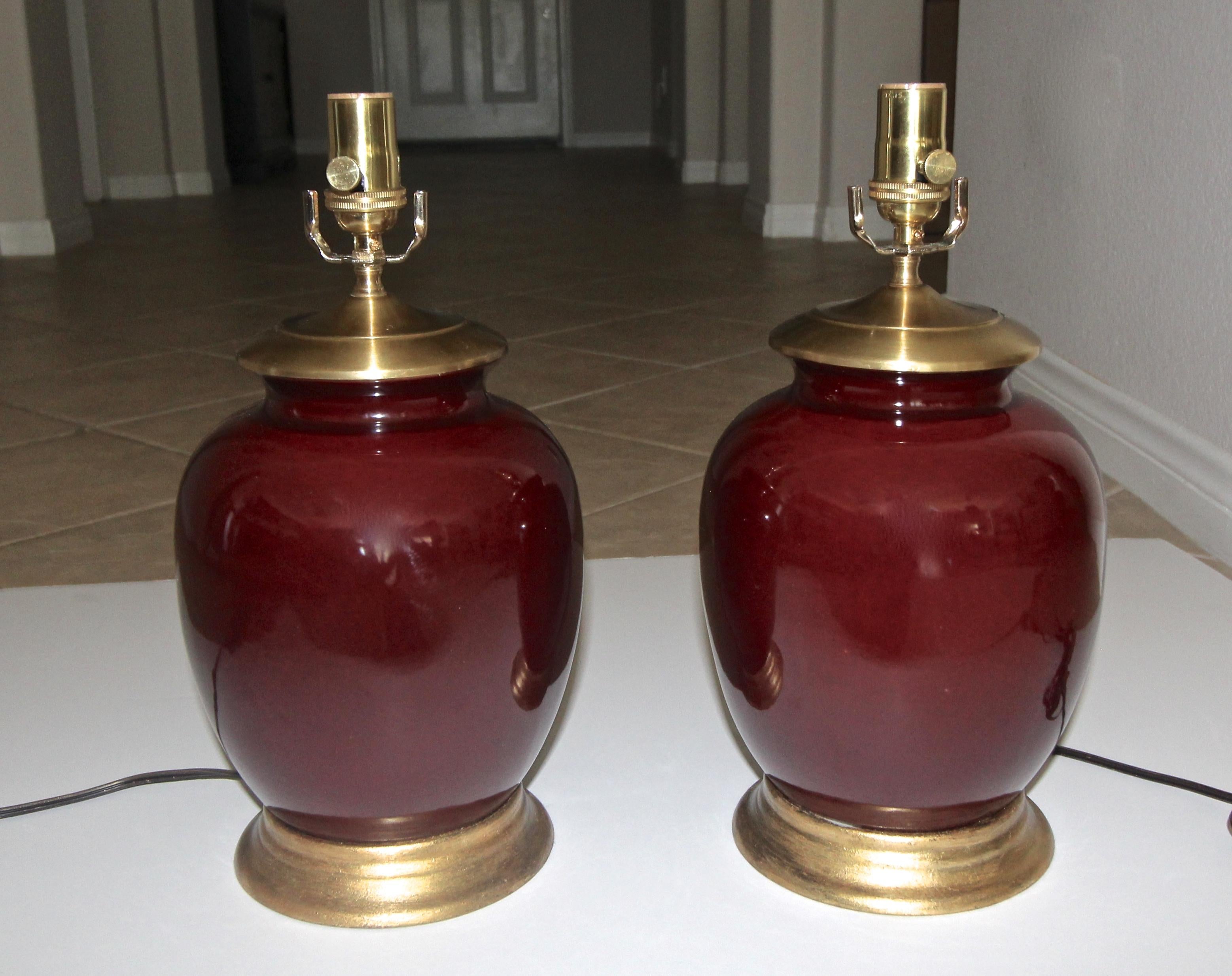 Brass Pair of Asian Oxblood Porcelain Lamps