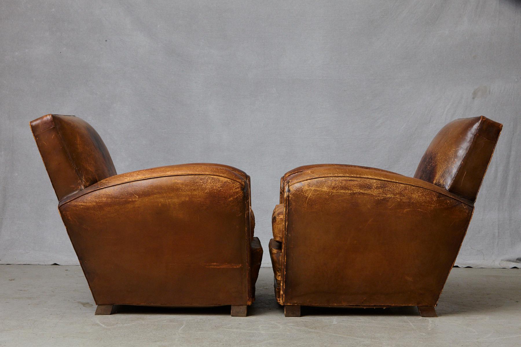 Pair of Large Distressed French Leather Fauteuils or Club Chairs, circa 1930s 1