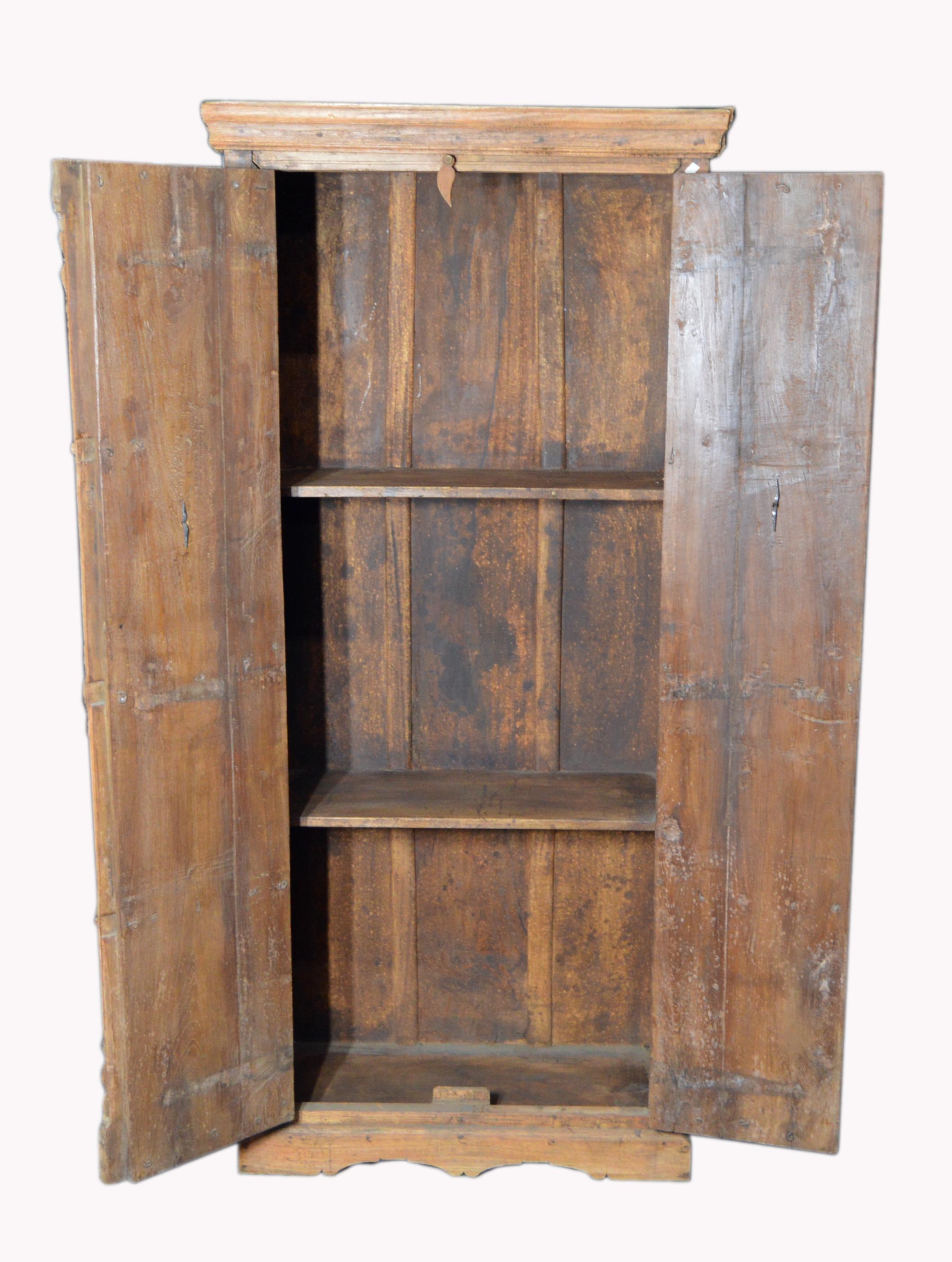 20th Century Indian Vintage Wooden Armoire with Metal Braces and Hand-Carved Decor