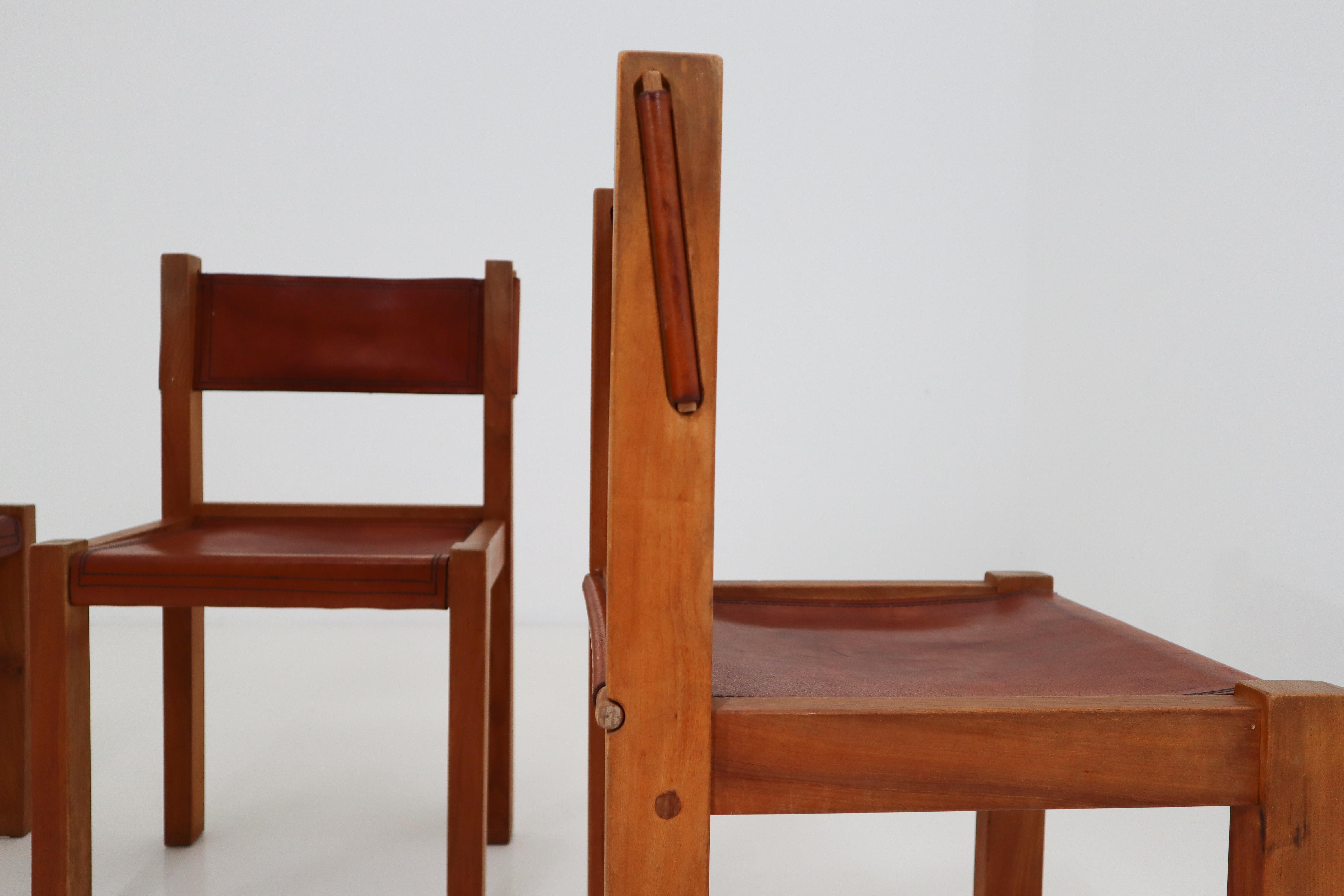 Four Midcentury Wood and Leather Dining Chairs 2