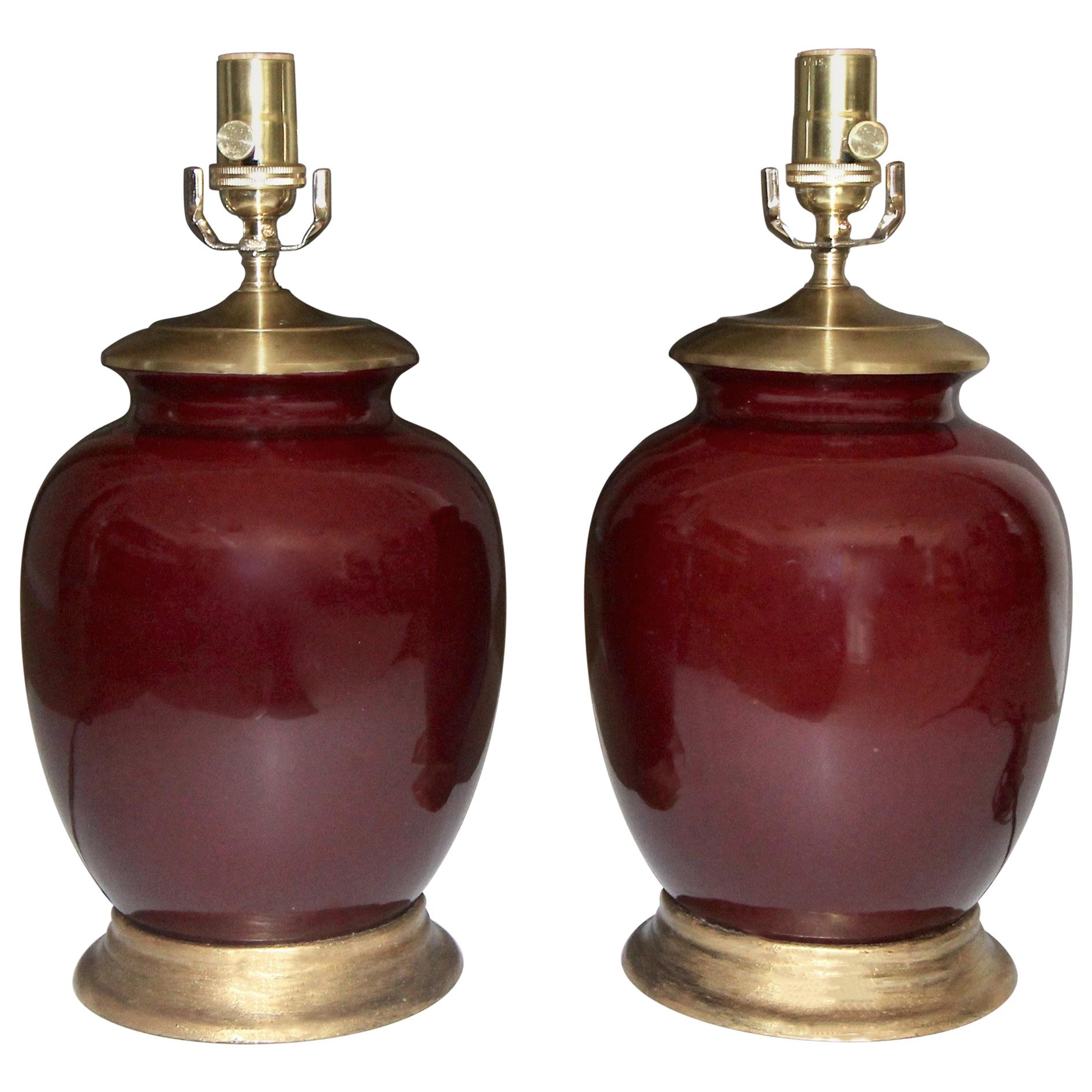 Pair of Asian Oxblood Porcelain Lamps