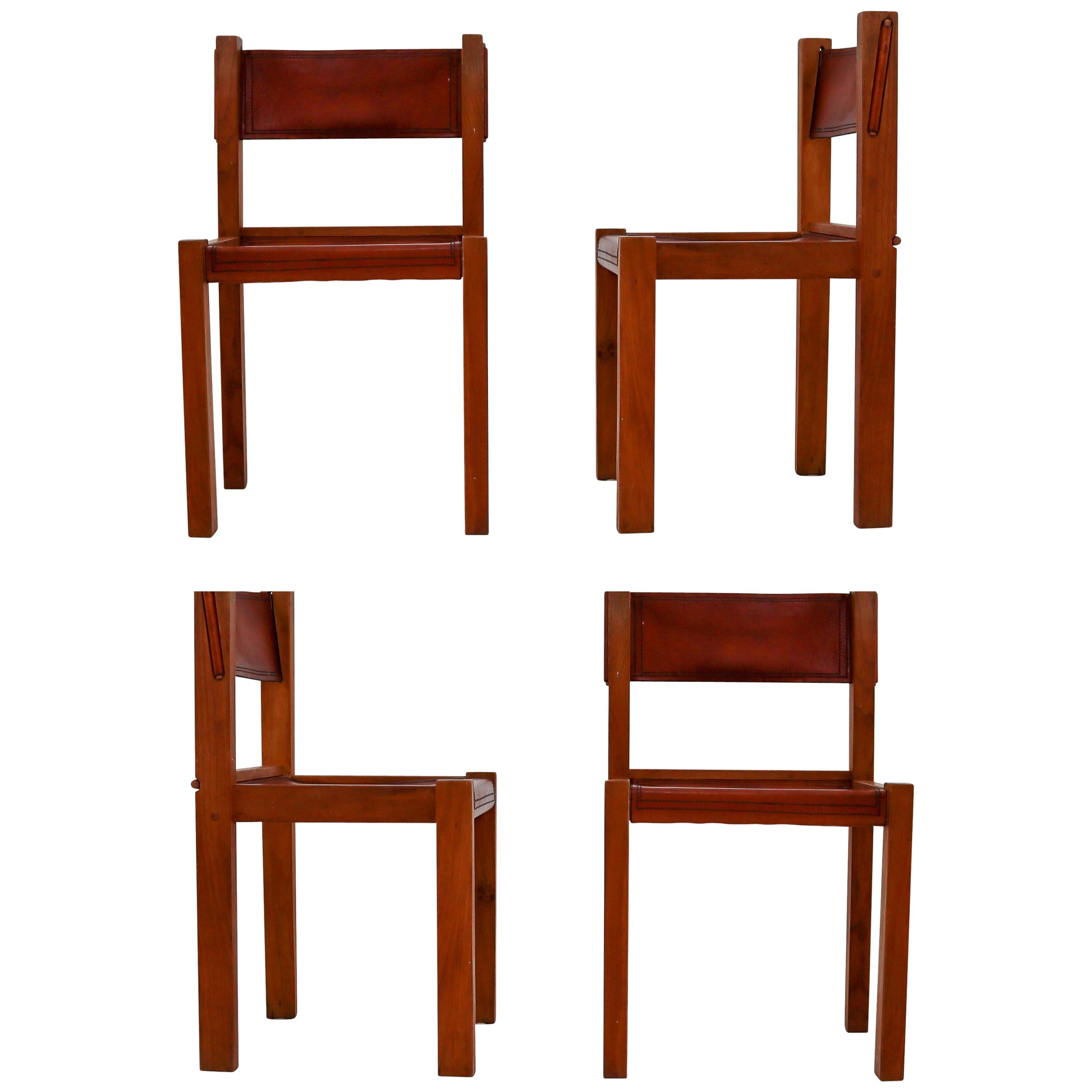 Four Midcentury Wood and Leather Dining Chairs