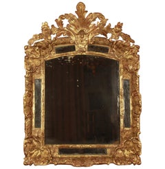 French Early 18th Century Régence Gilt and Carved Wood Mirror