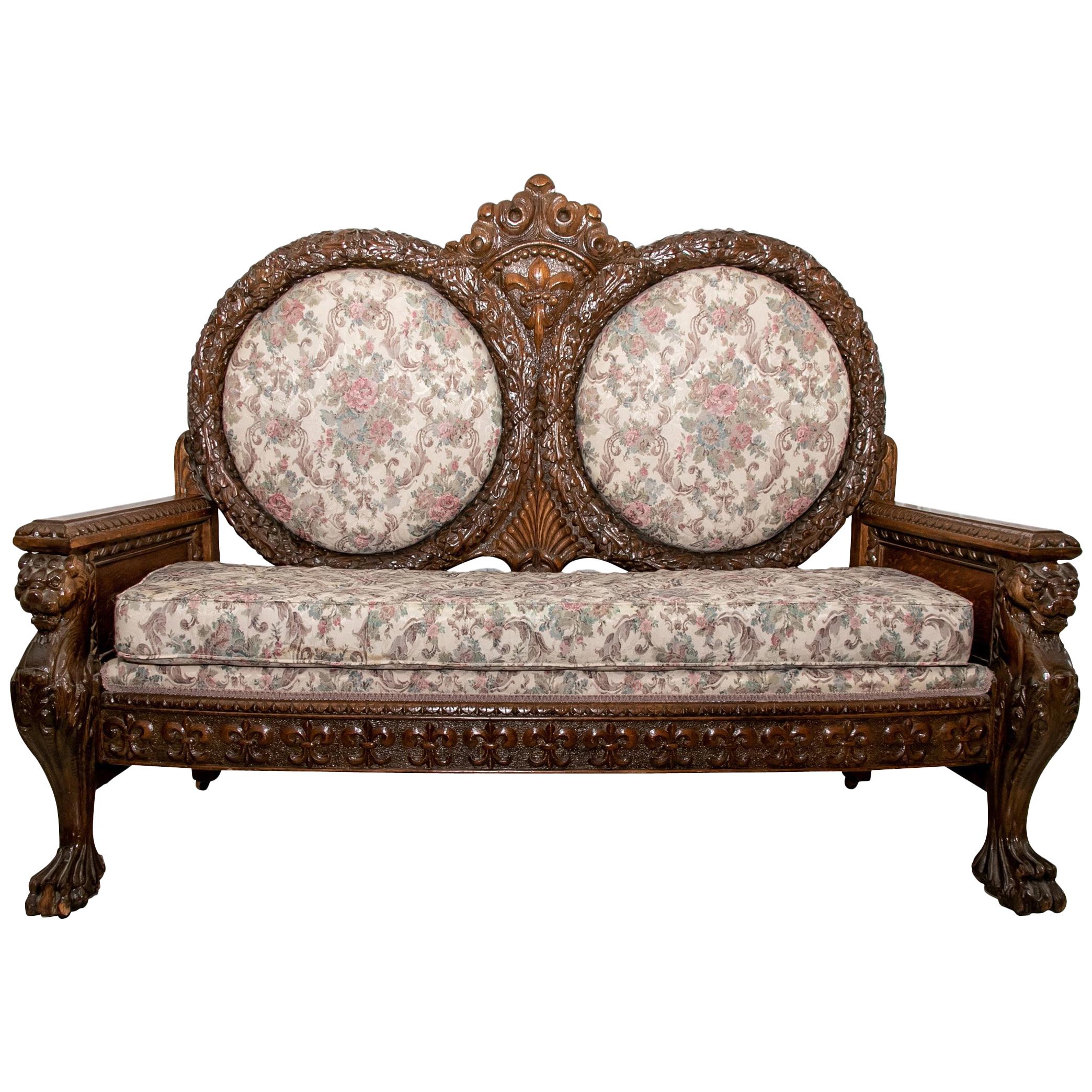 Late 19th Century Ornately Carved Oak Settee For Sale