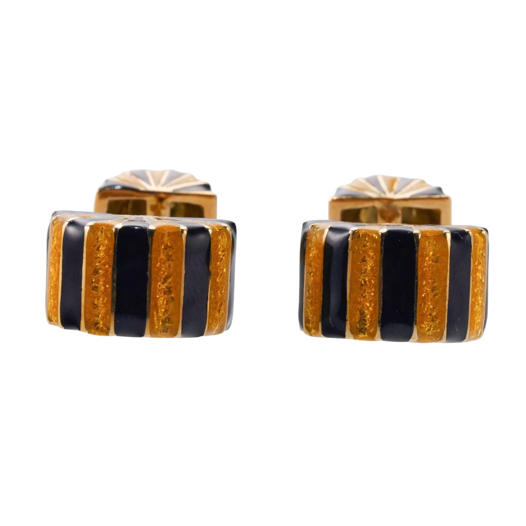 Pair of 18k gold striped enamel cufflinks by David Webb. Cufflink top measures 16mm x 10mm, back is 10mm x 8mm. Marked: David Webb, 18k, FS448. Weight is 17.3 grams.
